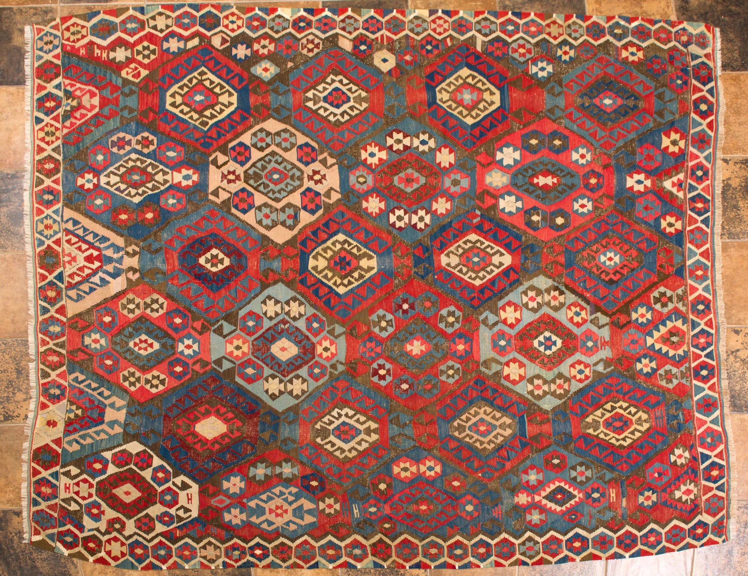 Classic Shirvan kilim dating back to the end of the 19th century. It has no restorations, but the surface is a little worn , even because tle black color for the wool was often obtained by iron oxide which corroded the wool.
On the other hand the