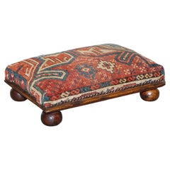 ANTIQUE RUG KILIM TRIBAL RUG UPHOLSTERED FOOTSTOOLED RAISED ON BUN FEET WTH STUDS