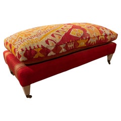 Antique Kilim Upholstered Pouffe with Four Wooden Legs and Brass Castors