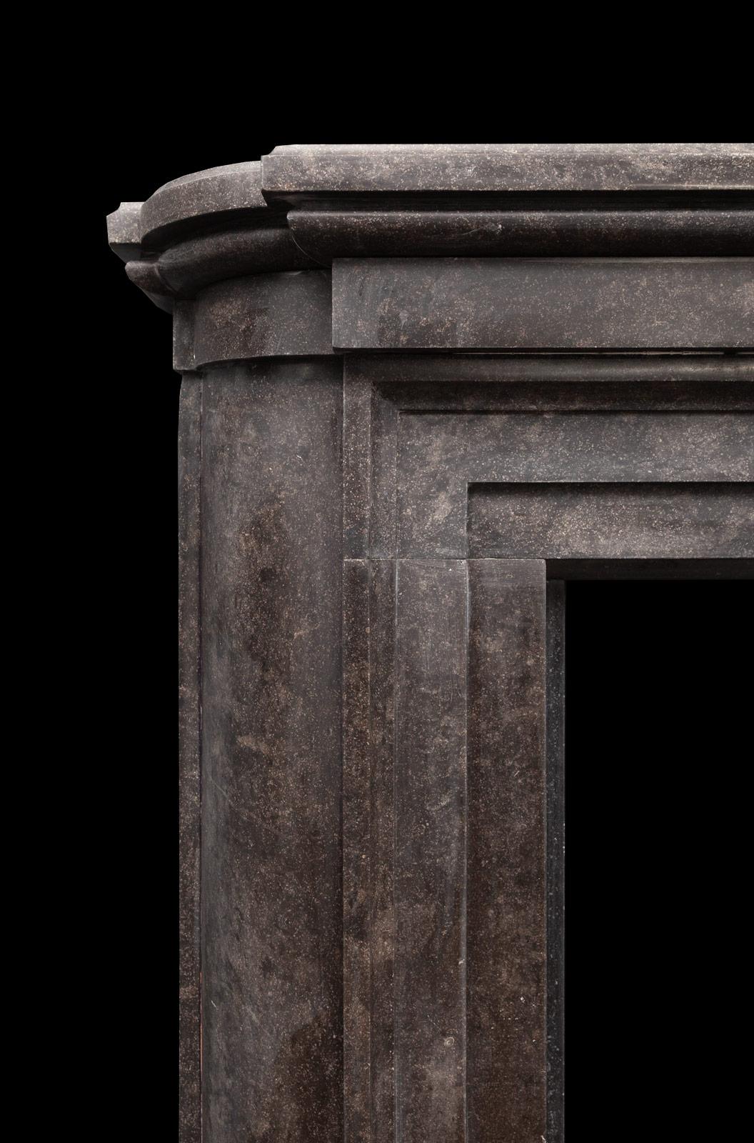 Antique neo-Georgian style Kilkenny marble fireplace surround. Designed by Frank Atkinson in 1908 for his residence ‘Redcot House’. This neo-Georgian style fireplace made from polished Kilkenny limestone featuring simple lines, moldings and contours