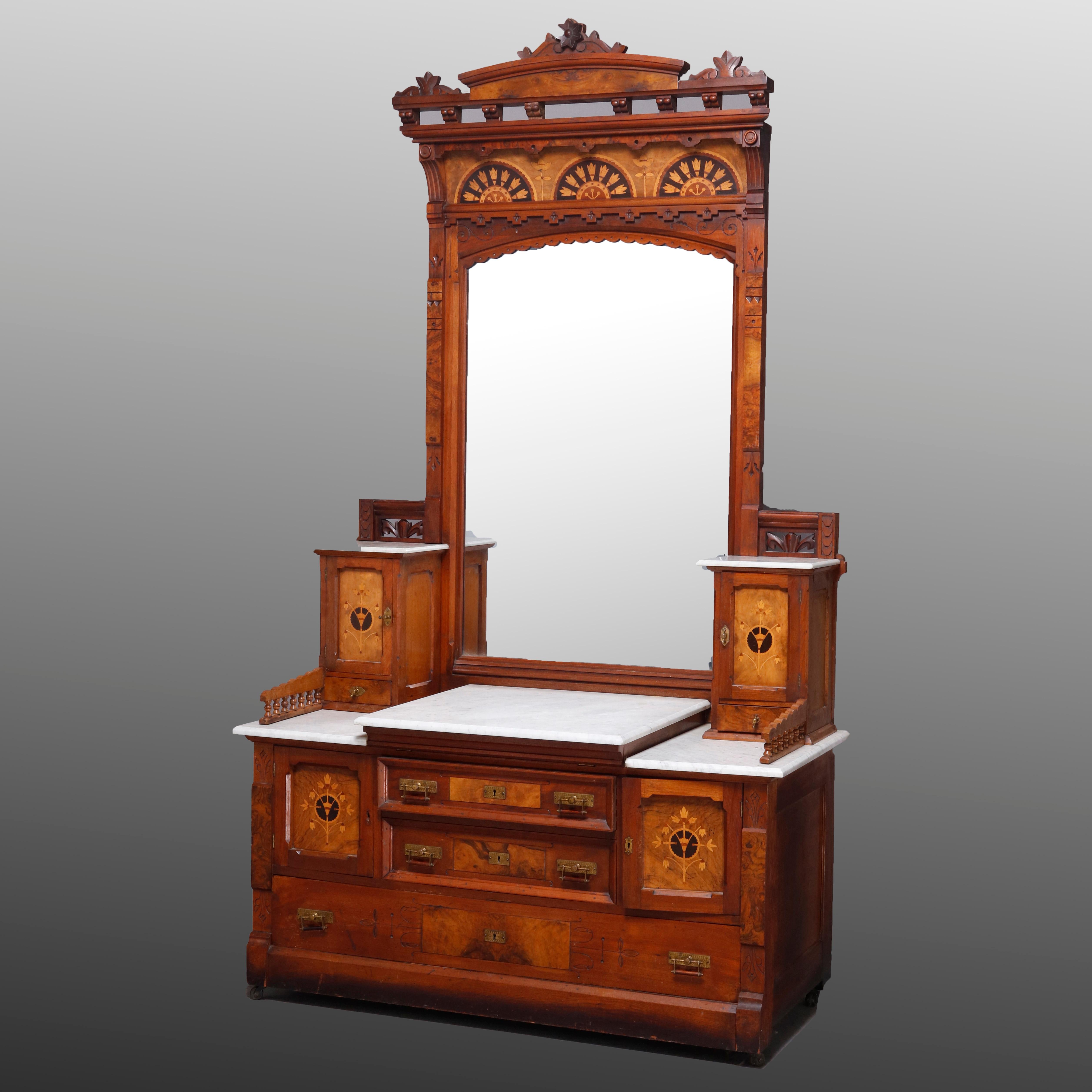 Antique Kimbel & Cabus three-piece bedroom suite offers walnut construction with pierced crest having carved roses and banding, inset burl panels with ebonized and floral inlaid marquetry reserves throughout. Set includes full bed, side stand and