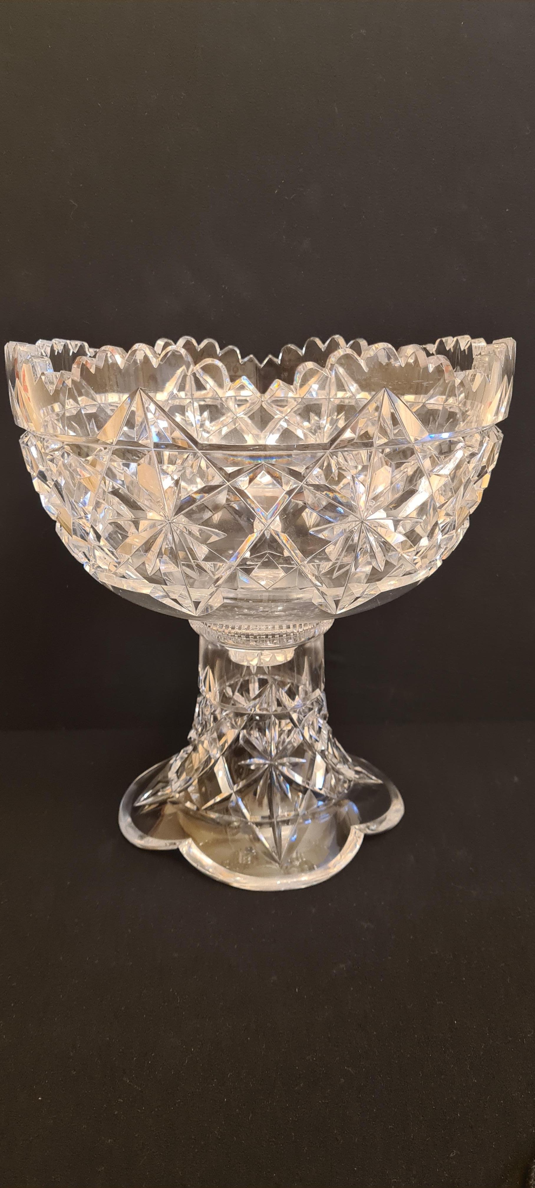 Amazing antique American Brilliant cut crystal punch bowl by Hawks & Co.; Years 1880-1900. 
This cut crystal two piece punch bowl, stand and bowl by T.G. Hawkes & Co. exibits the brilliant kings pattern. The kings pattern is the rarest of the