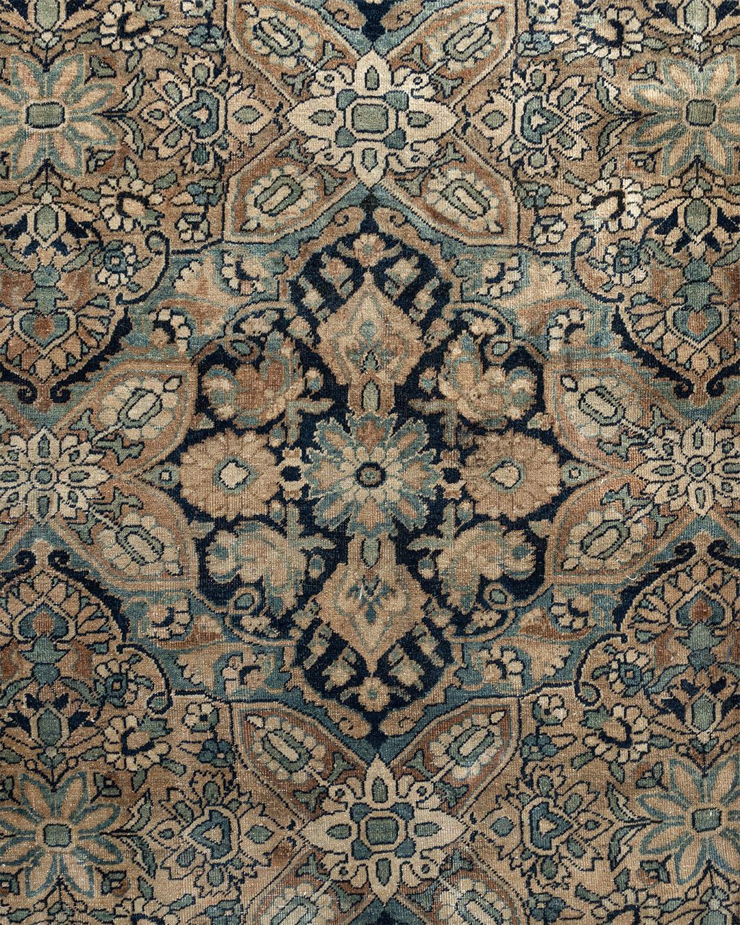 Antique Kirman rug, circa 1880, 13' x 20'. Kirmans of the late 19th century are thin fine rugs with most often overall repeat pattern. Here a subtly colored diagonal lozenge lattice encloses floral medallions. There is no distinct field color but