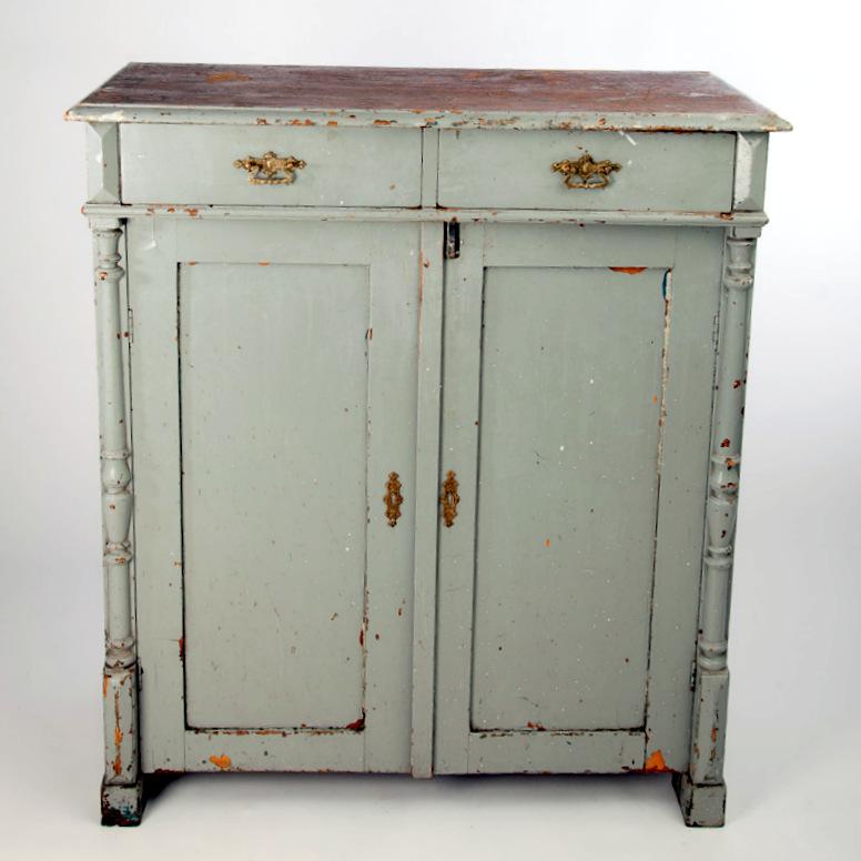 Grey painted kitchen cabinet with drawers and inside shelves.