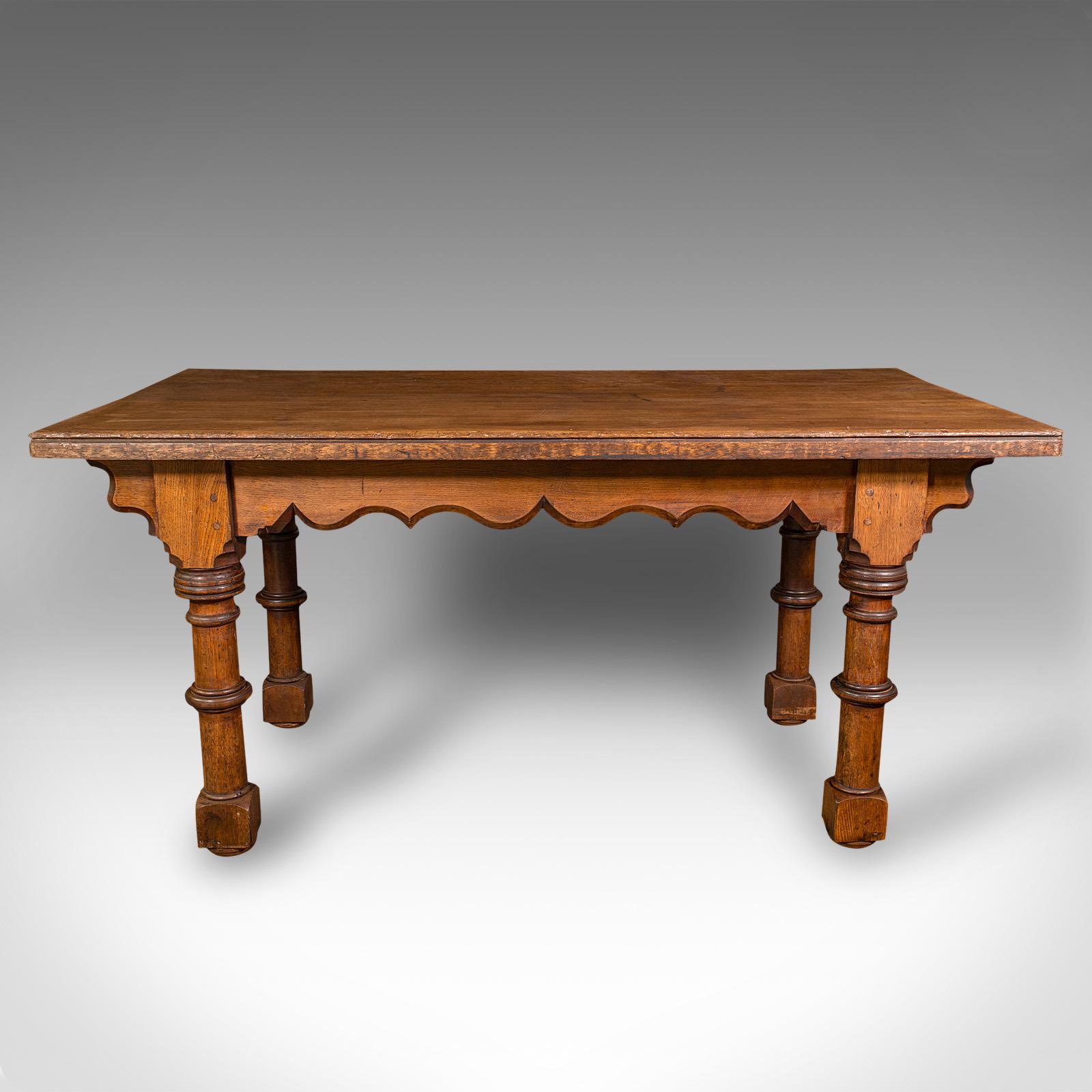 This is an antique kitchen dining table. A Scottish, oak 4-6 seat table with Gothic revival taste, dating to the Victorian period, circa 1870.

Wonderfully solid and characterful with superb figuring and a great dining height of 83cm