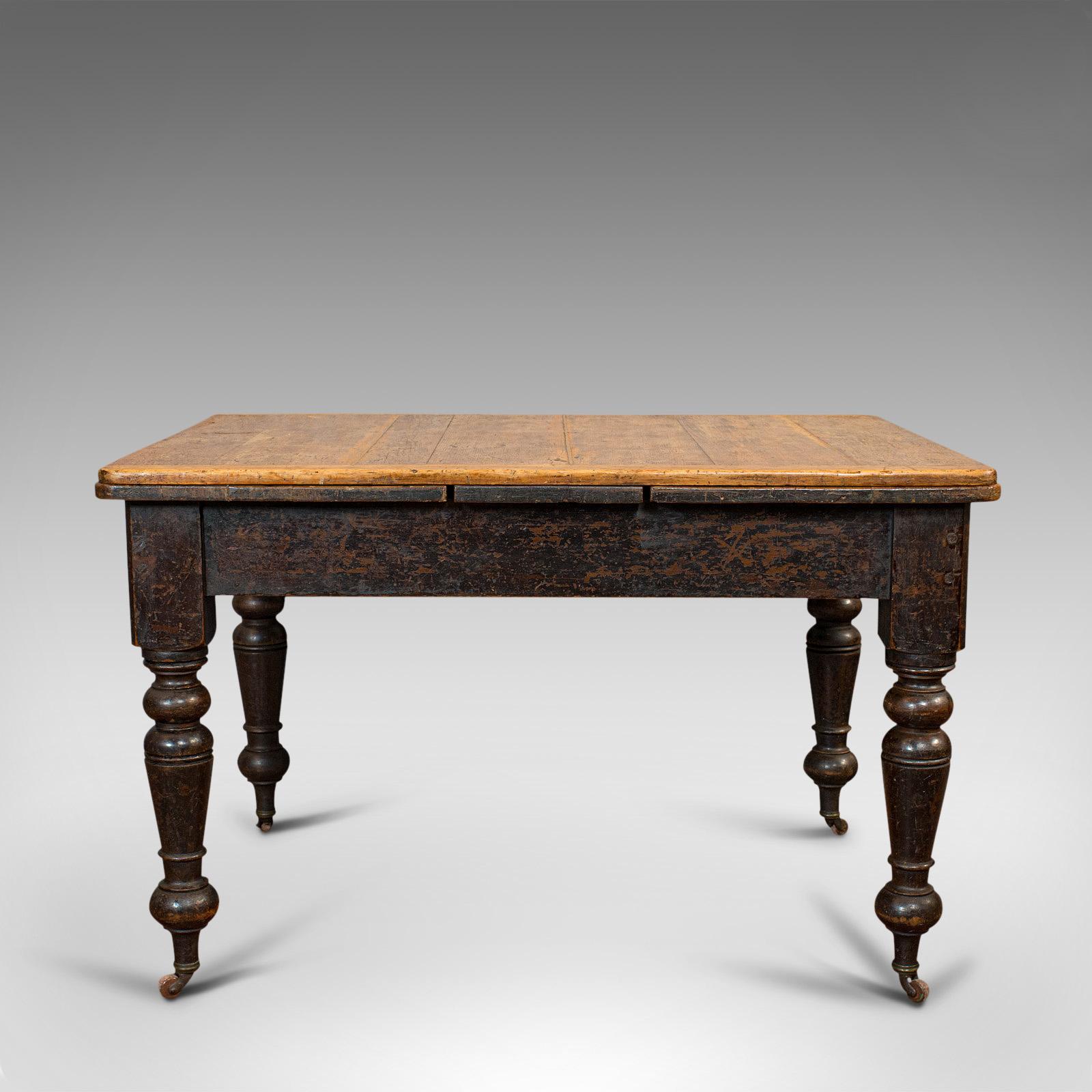 This is an antique kitchen table. An English, extending scrub top dining table, dating to the Victorian period, circa 1870.

Charming, with country house appeal
Displaying a desirable aged patina
Original dark stained pine shows appealing