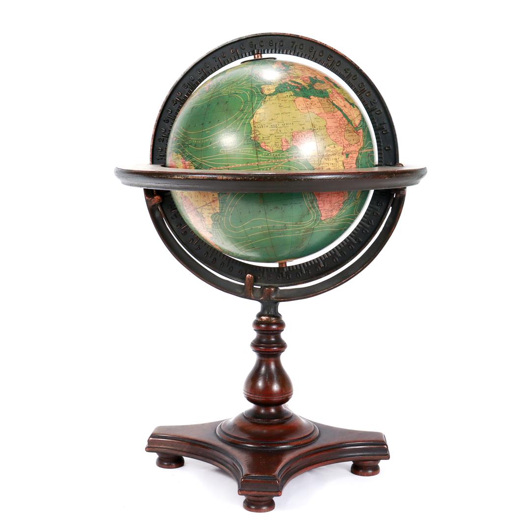 globe in wooden stand