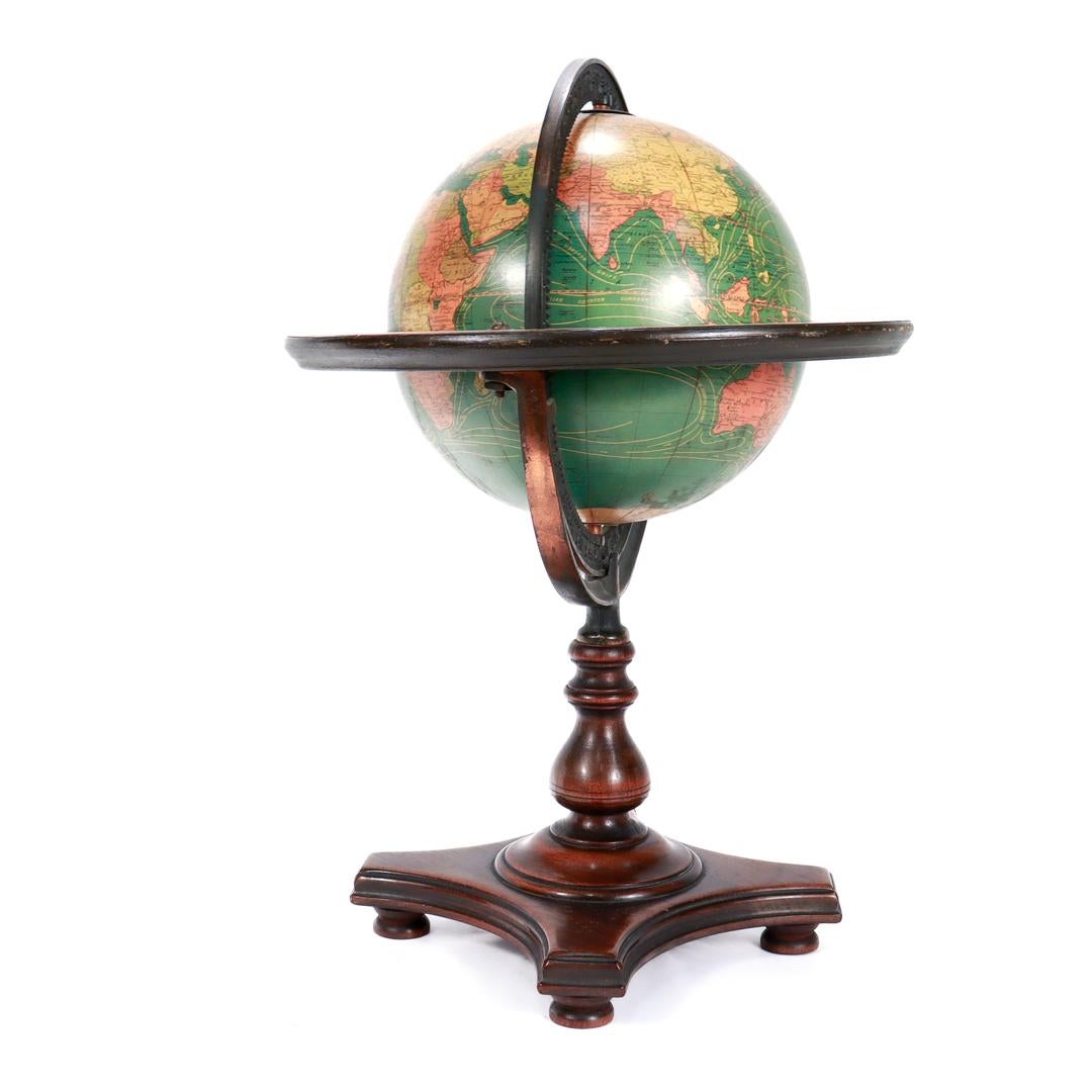 Antique Kittinger 8-inch Terrestrial World Globe on a Mahogany Wooden Stand In Good Condition For Sale In Philadelphia, PA