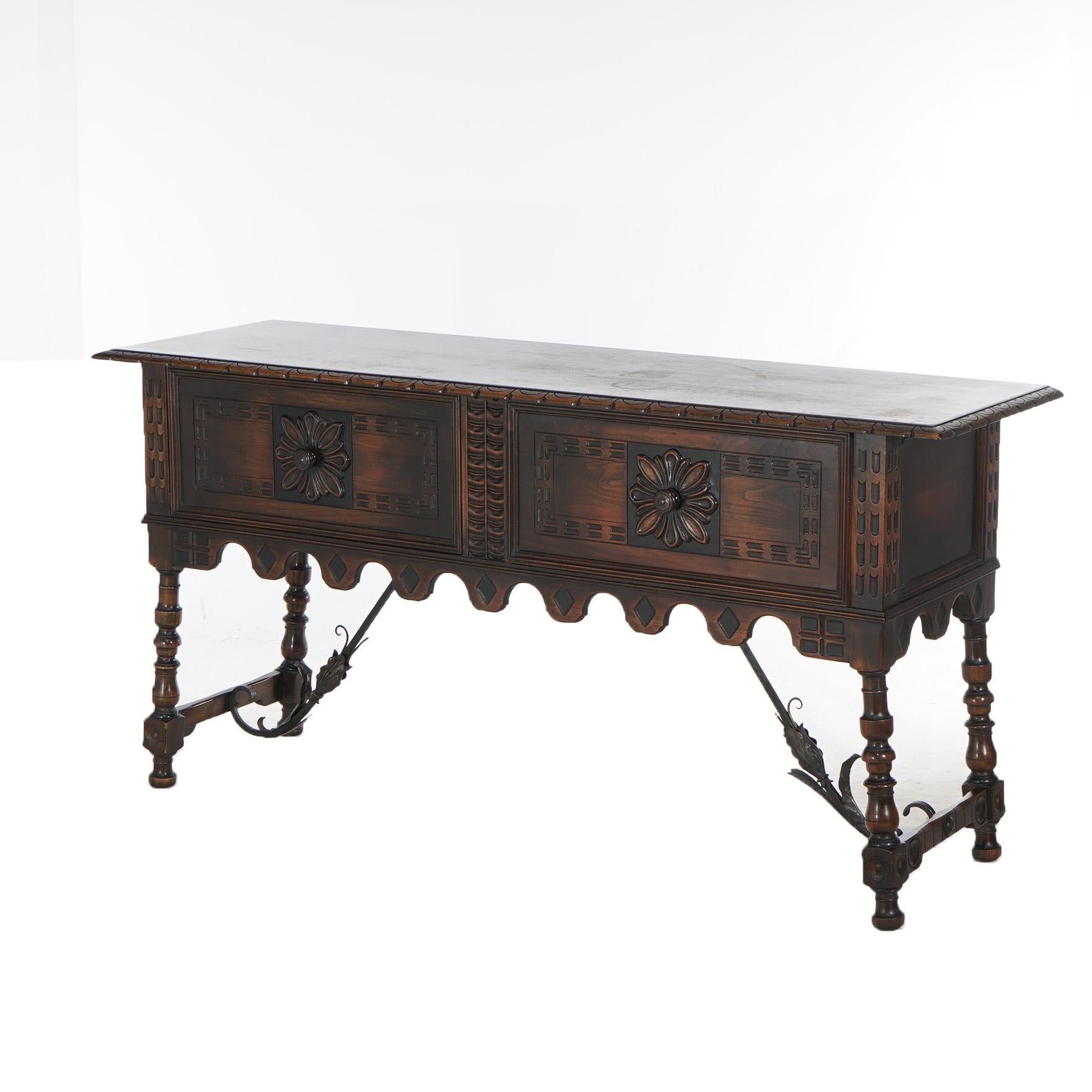 ***Inquire About Reduced In-House Delivery Rates - Reliable Professional Service & Fully Insured***

Antique Kittinger Jacobean Style Carved Walnut & Foliate Form Wrought Iron Sideboard with Carved Stylized Floral Elements and Turned Legs,