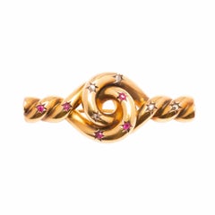 Antique Knot brooch with rubies and diamonds