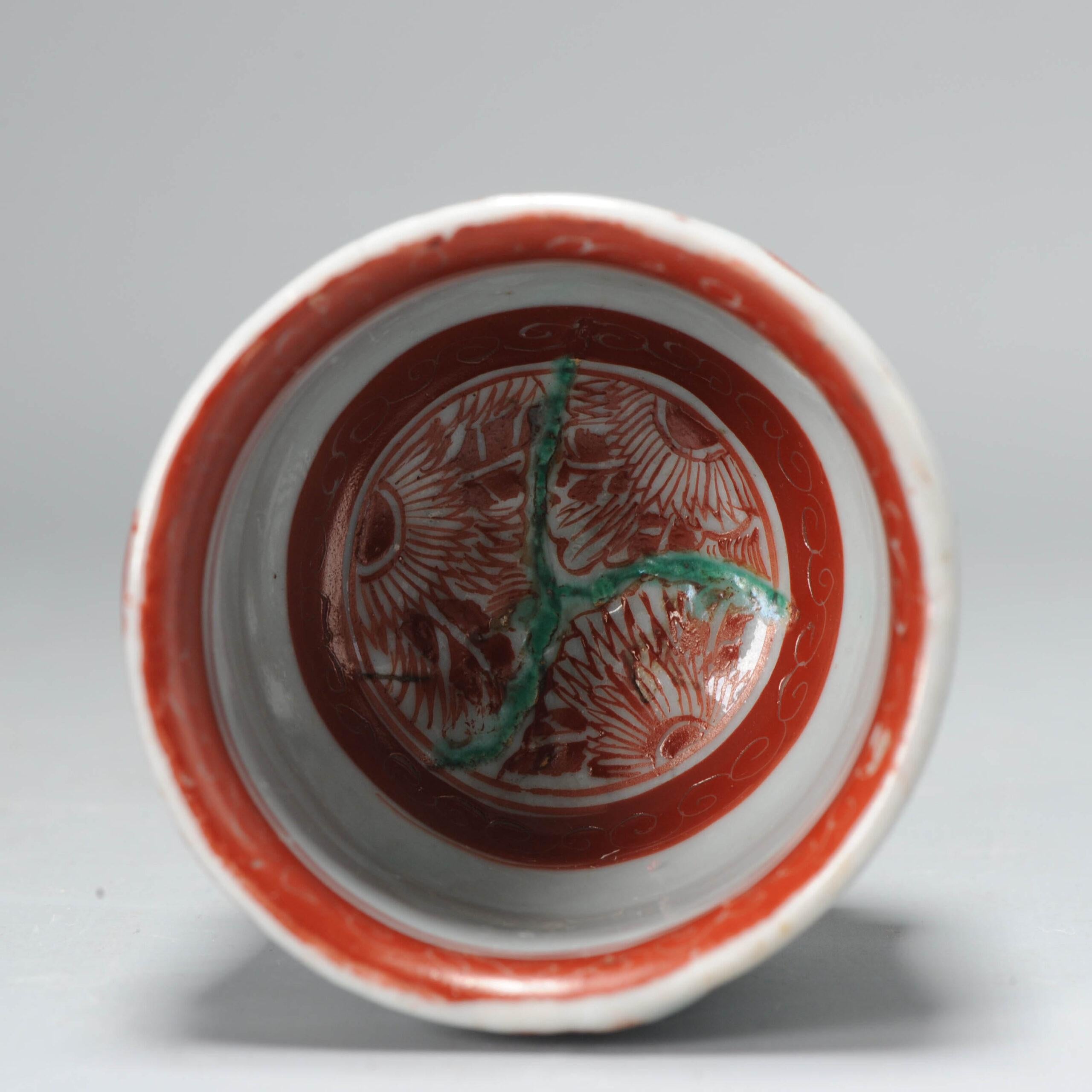 This nice tea bowl/cup (might also be incense burner) from the early 17th century. With a Wucai/Verte scene of a wise man in a garden. The base with an overglaze red Chenghua mark. The fun part is that the red circled green parts on the body are