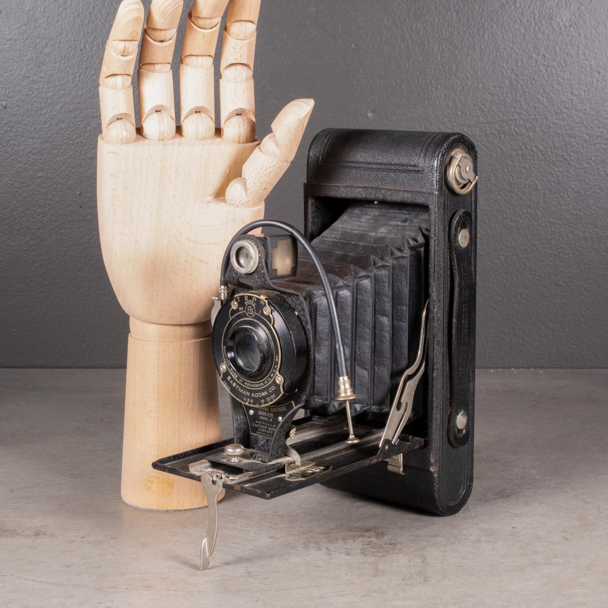 ABOUT

A Hawk-Eye Shutter Model 2A folding camera, model B with a leather wrapped body, chrome and brass accents and extended push button shutter mechanism. Closes to 1.5 inches flat.

Shown with life size hand.

    CREATOR Eastman Kodak Co.
   