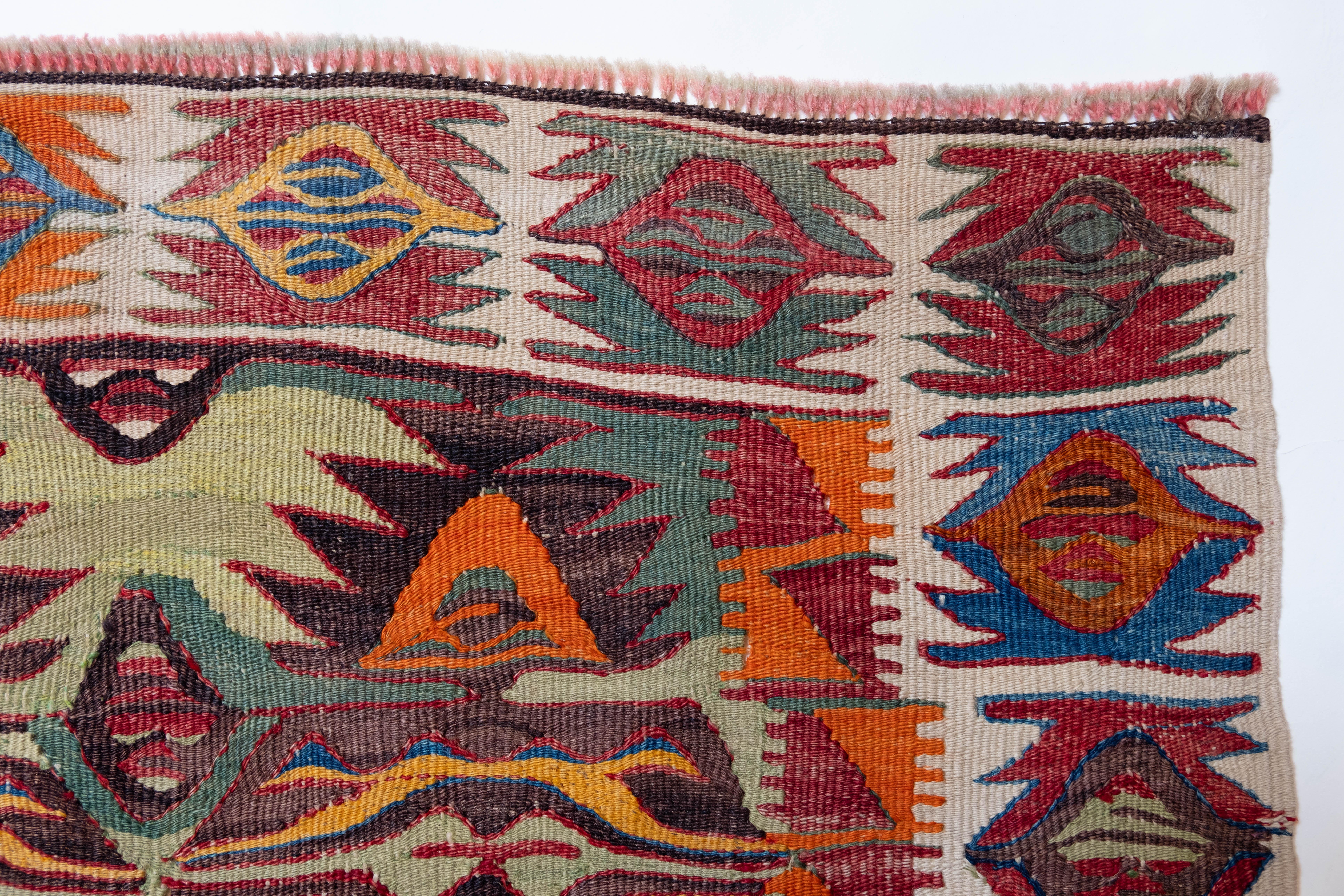 This is Central Anatolian Antique Kilim from the Hotamis, Konya region with a rare and beautiful color composition.

This highly collectible antique kilim has wonderful special colors and textures that are typical of an old kilim in good condition.