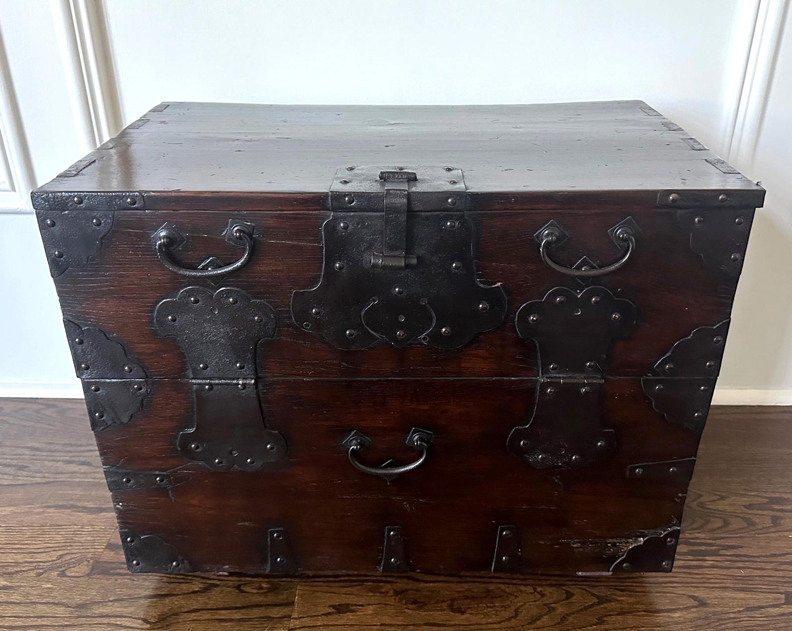 An antique Bandaji chest from Korea circa late 19th century Joseon Dynasty. The relatively small open-front cabinet was constructed from stained elm wood and fitted with thin hammered iron hardware. It was produced Changhung area (nowadays