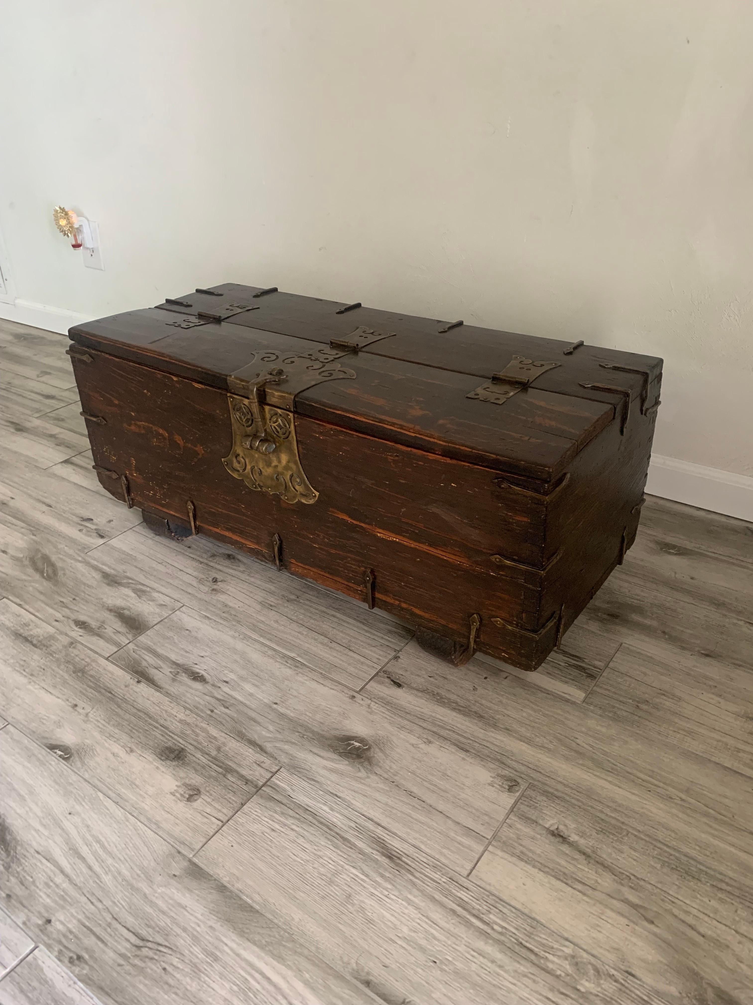 Charming antique coin box. From the Joseon Dynasty period. Chest is made from hardwood with dovetail joinery. 

Has heavy patina and shows it’s age very well. Has aged with grace. Hinges work great and offer plenty of storage inside.

34” long 15.5”