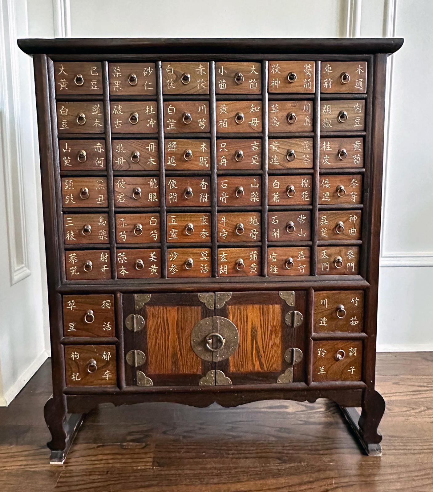 A Korean medicine or apothecary chest with curved leg support circa the first quarter of the 20th century. Known as Yakchang in Korea, the chest was used to sort and store herb medicines in its many small drawers. The prototype was originated in