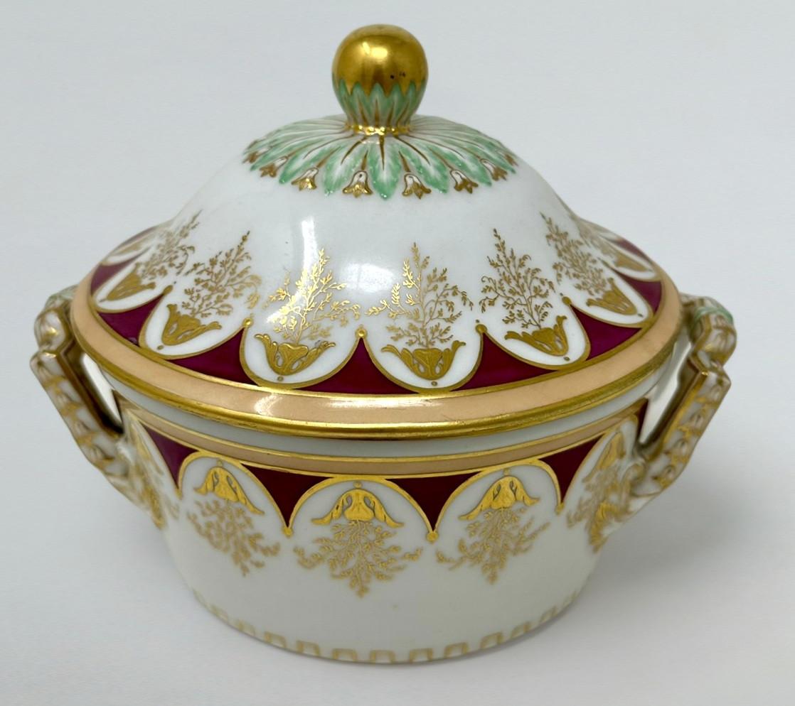Stunning imposing Hand Decorated Berlin Porcelain KPM Lidded Twin handle circular Centerpiece of museum quality, late Nineteenth, early Twentieth Century. 
The hand painted dome shaped cover in colours of green and iron red on a white ground with