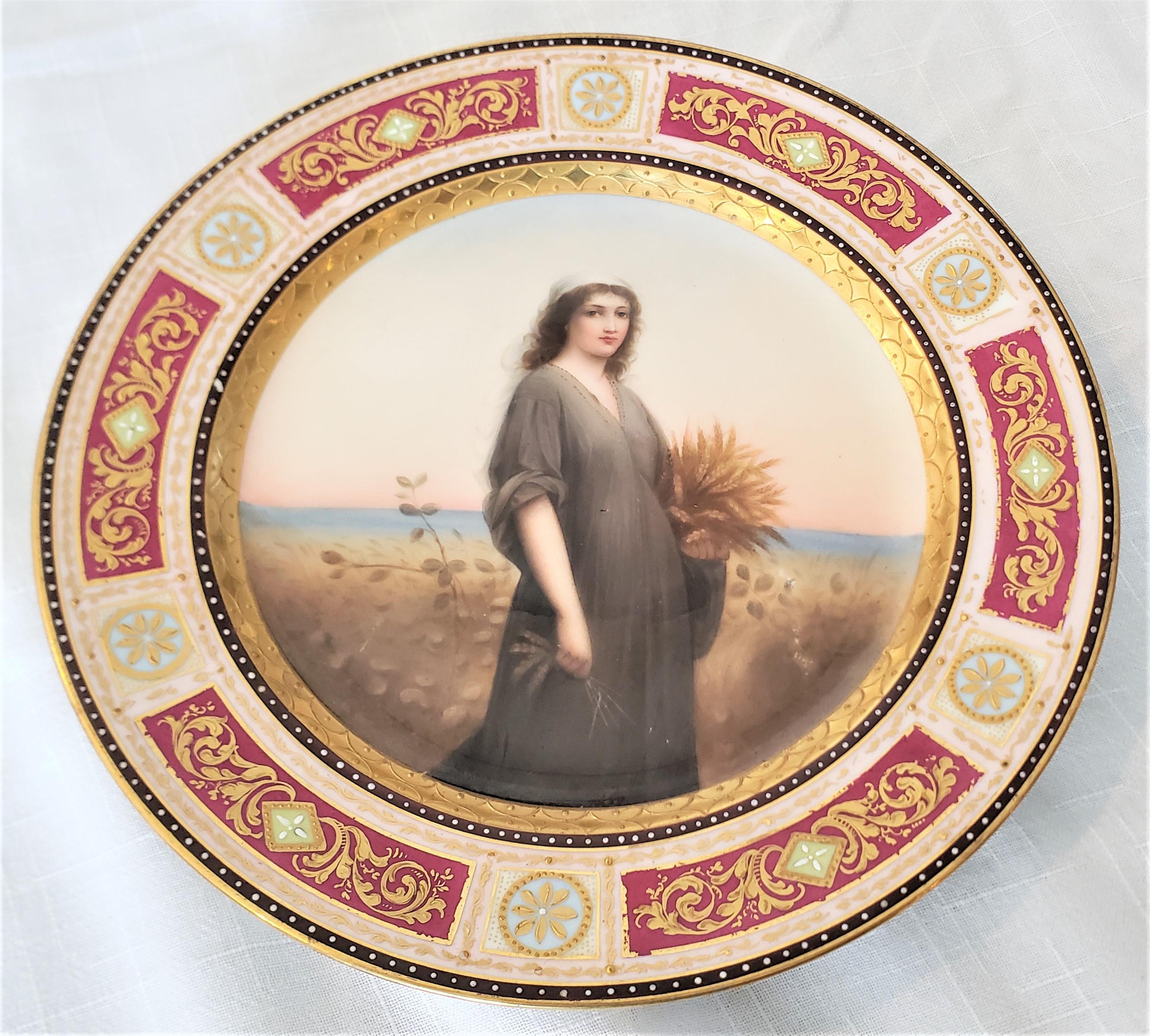 This antique hand-painted porcelain cabinet plate was made by the renowned KPM porcelain factory of Germany in approximately 1880. The center of the plate features a depiction of the Biblical 