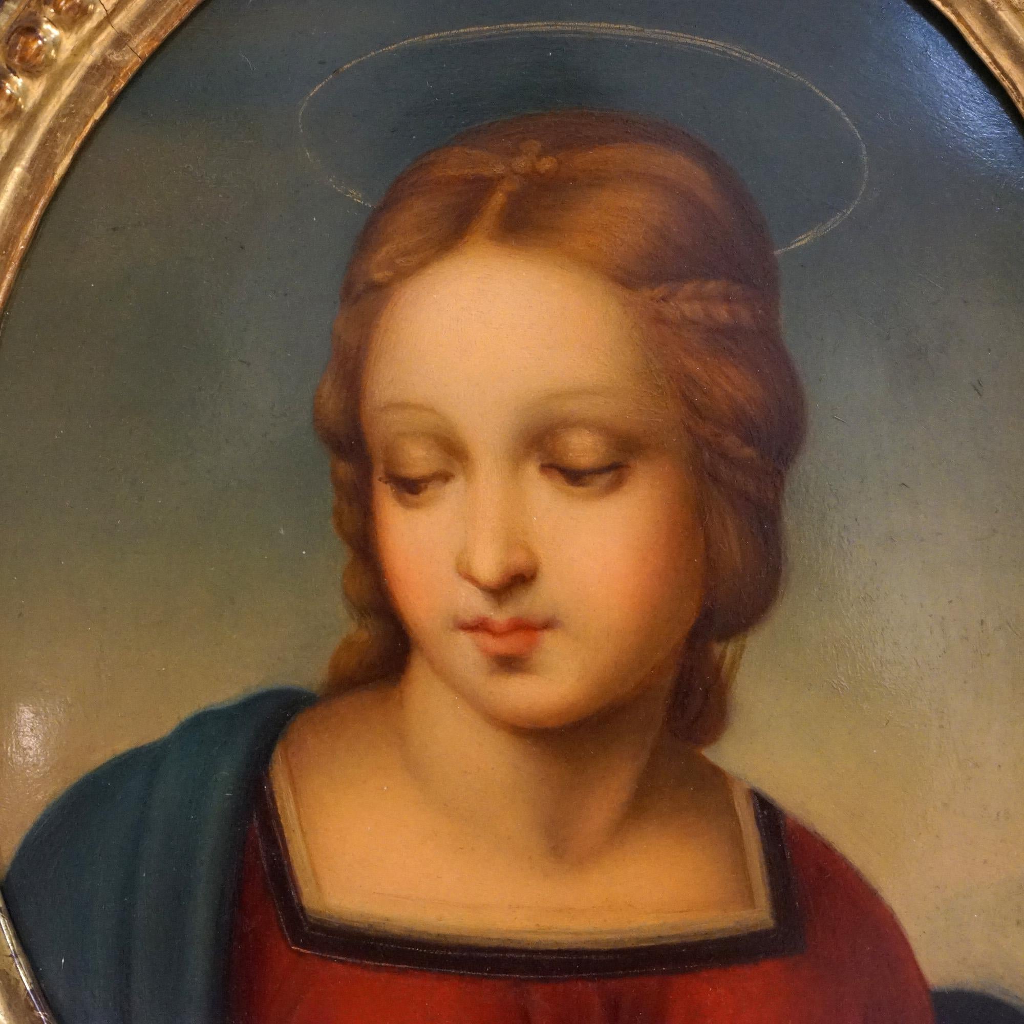 An antique KPM portrait painting on porcelain of Madonna Of The Goldfinch after Raphael of Florence, seated in carved Italian giltwood frame, 19th C

Measures - 19.5