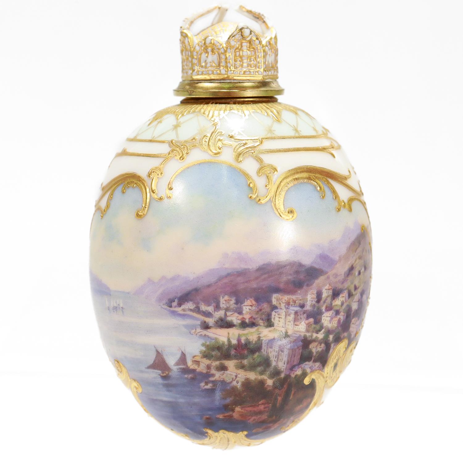 A fine antique porcelain egg shaped flacon or bottle.

By the Royal Berlin KPM Porcelain Manufactory (Die Königliche Porzellan-Manufaktur Berlin).

With  a hand-painted topographical scene of a town on the banks of the Rhine (am Rhein) River,