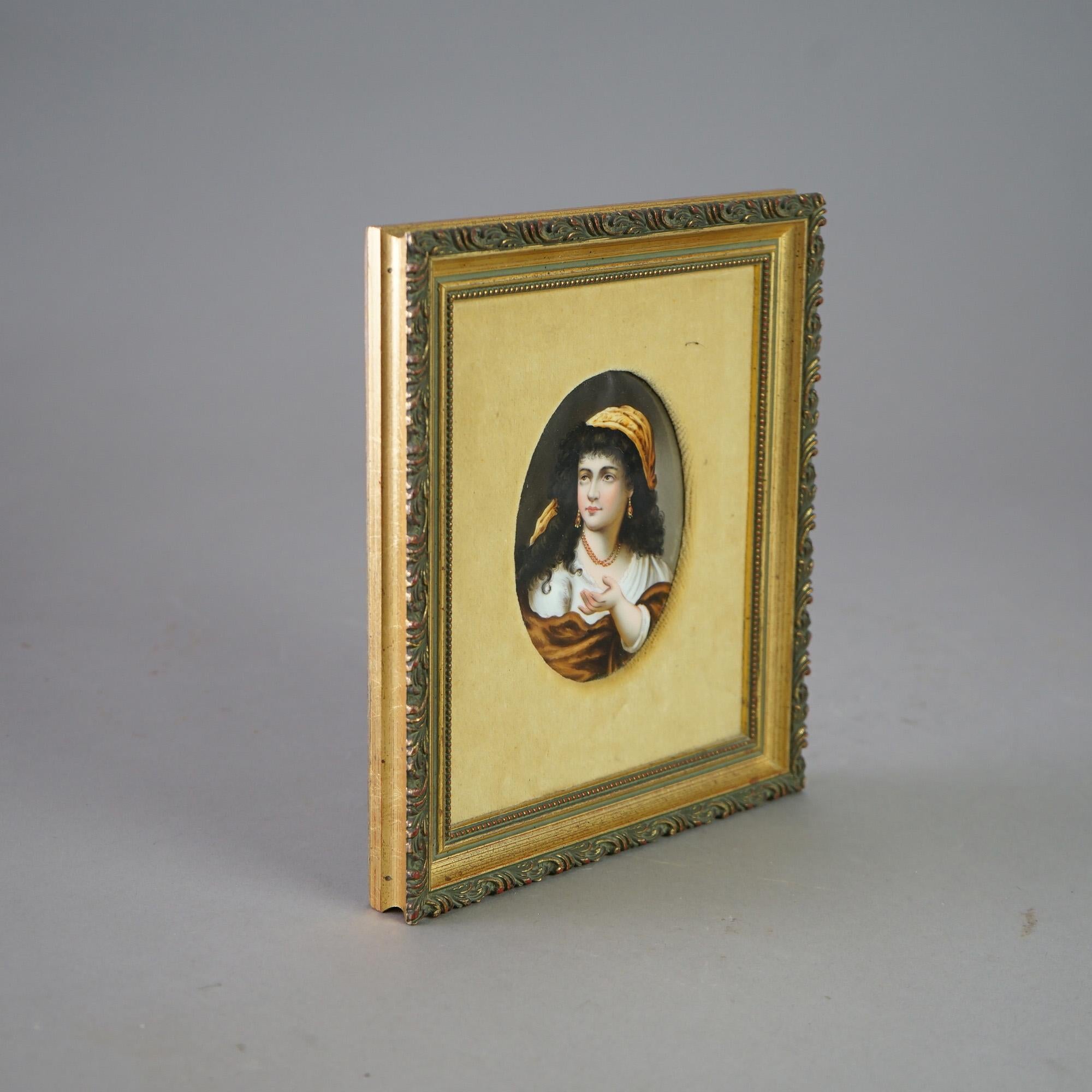 An antique portrait in the manner of KPM offers hand painted gypsy woman on porcelain plaque, seated in giltwood frame, signed, 19th century

Measures- 9.5''H x 8.25''W x 1.25''D
