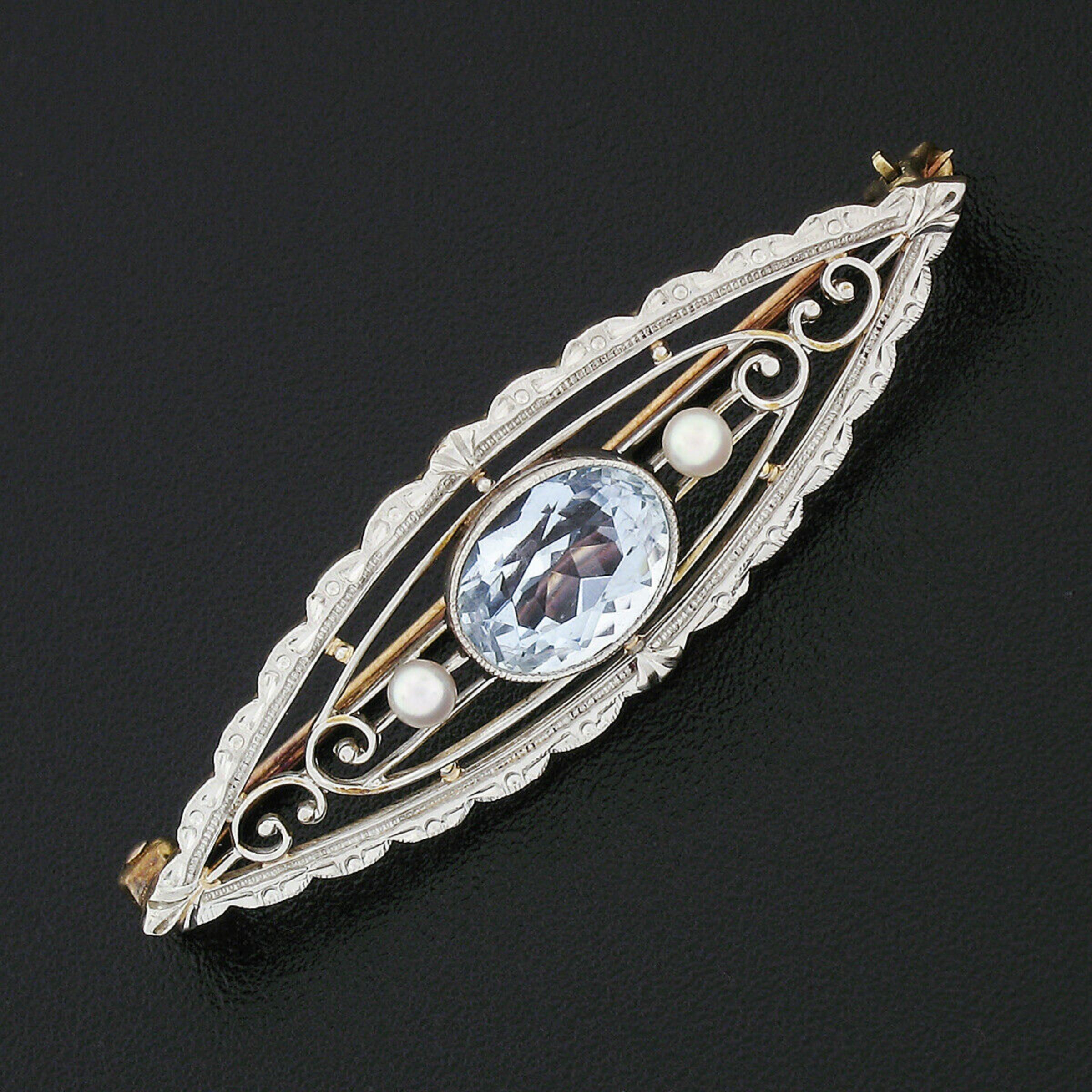 This beautiful Krementz antique pin/brooch was crafted in solid 14k yellow gold with a solid .900 platinum top during the art nouveau period and features an open, scalloped, marquise shape. The outer frame of the brooch is covered with beautiful