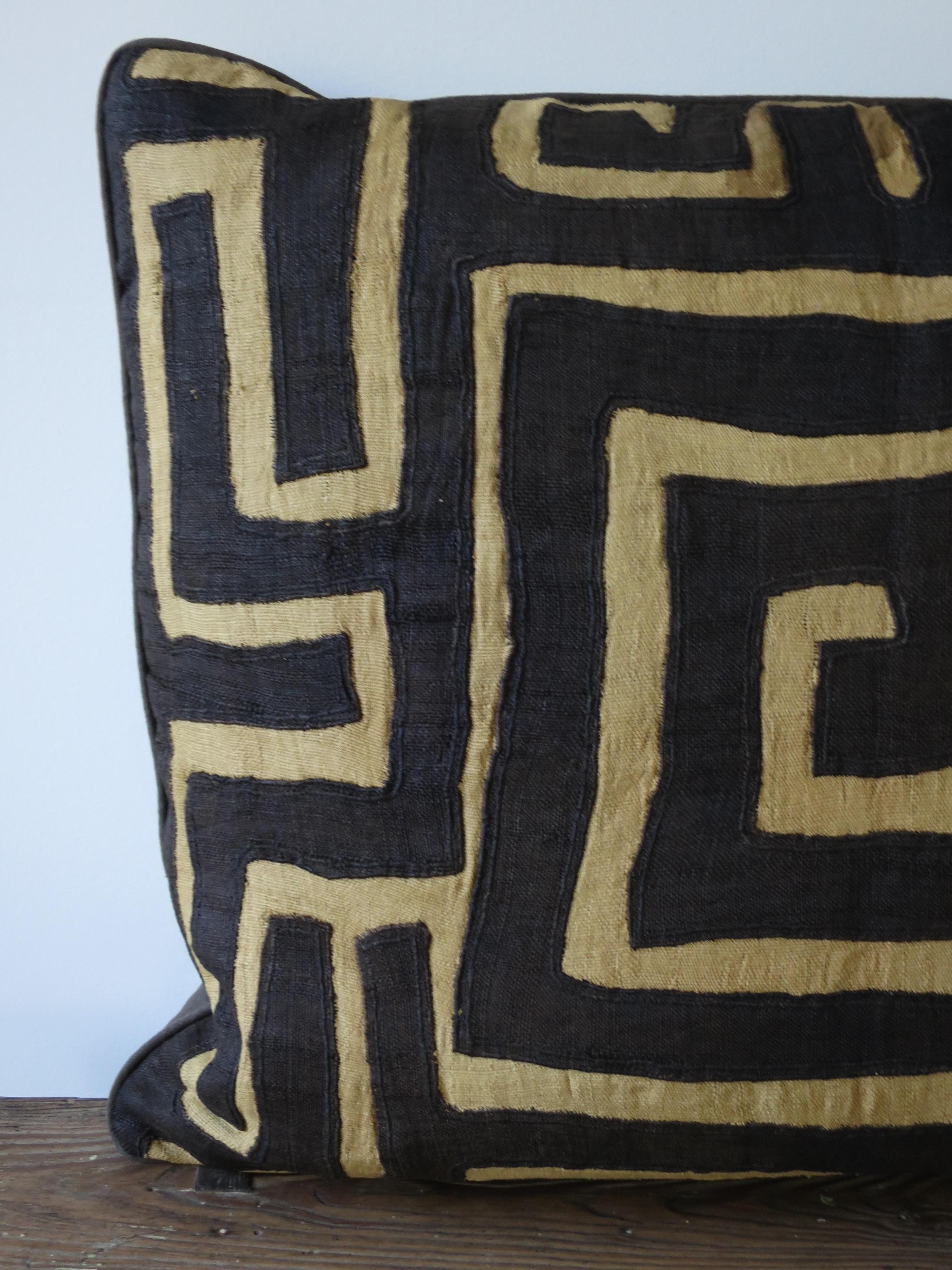 Antique Kuba cloth backed in linen, with all down stuffing pillow.
Originally came from a long panel of raffia cloth of 8 segments stitched together to make a ceremonial skirt. This one has a strong graphic presence with a Greek key at the center.
