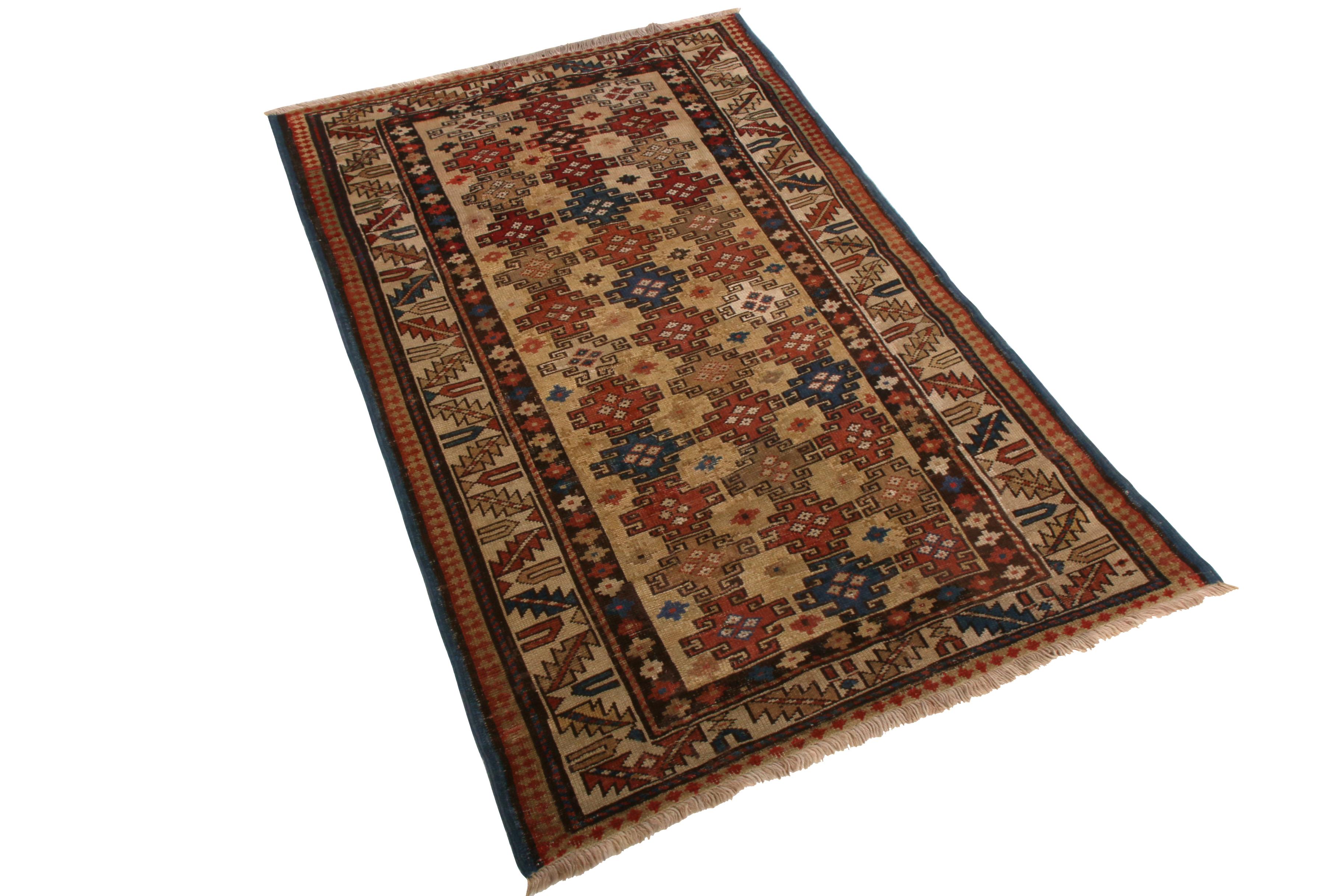 Hand knotted in wool originating from Russia between 1910-1920, this antique Kuba rug joins a selection of hand-picked favorites in Rug & Kilims antique and vintage rug collections selected for distinction and rarity. While the pallet of dancing red