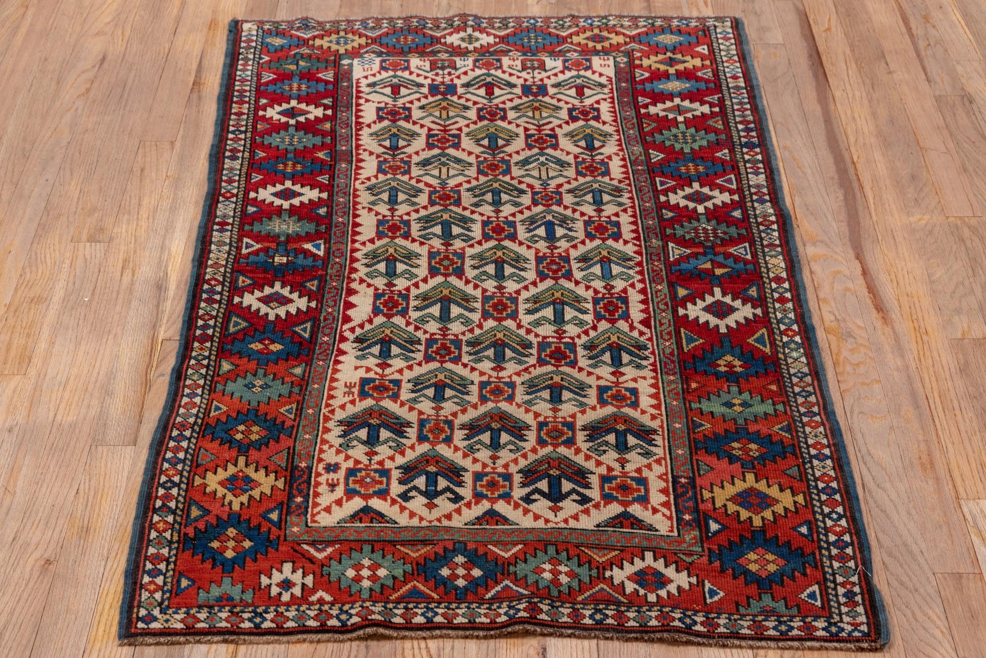 Caucasian Antique Kuba Rug with Red Border and Diamond Design For Sale