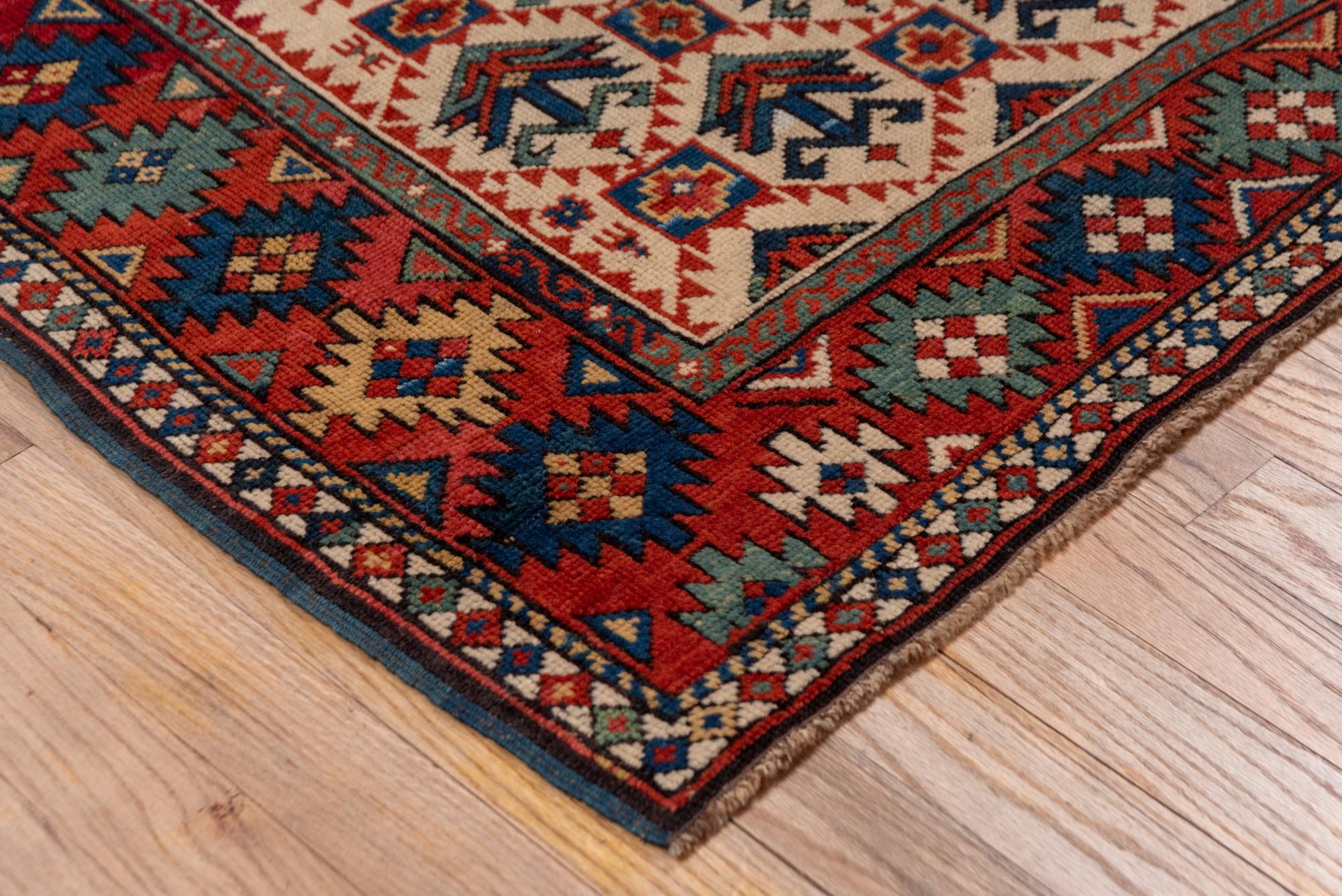 Wool Antique Kuba Rug with Red Border and Diamond Design For Sale