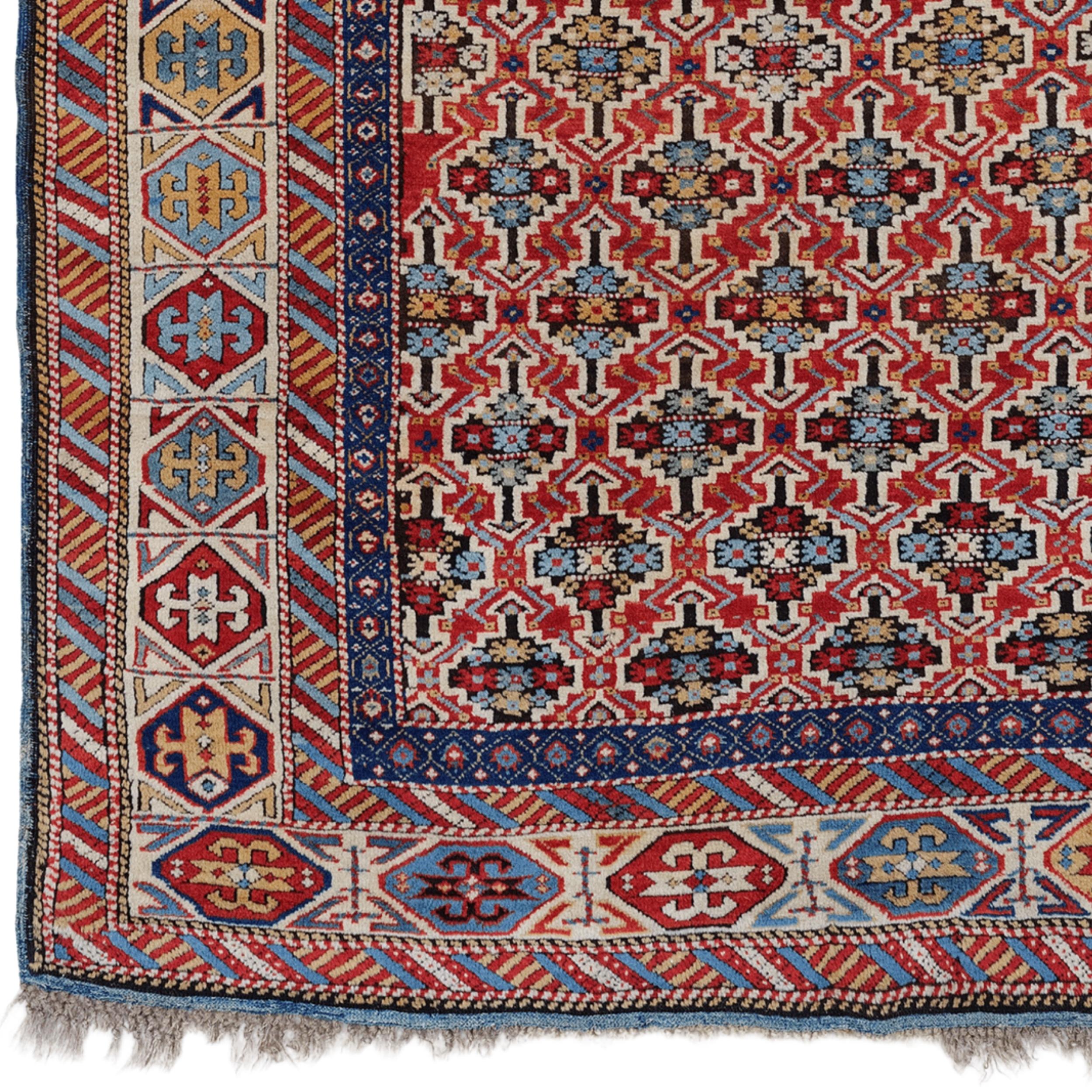 115 x 180 cm Origine: Shirvan (regione di Kuba-Shirvan), Caucaso orientale Periodo stimato: Metà del XIX secolo (1850-1860 circa)

Questo non è un semplice tappeto: è un'opera d'arte vivente, tessuta nei villaggi montani del Caucaso durante la metà