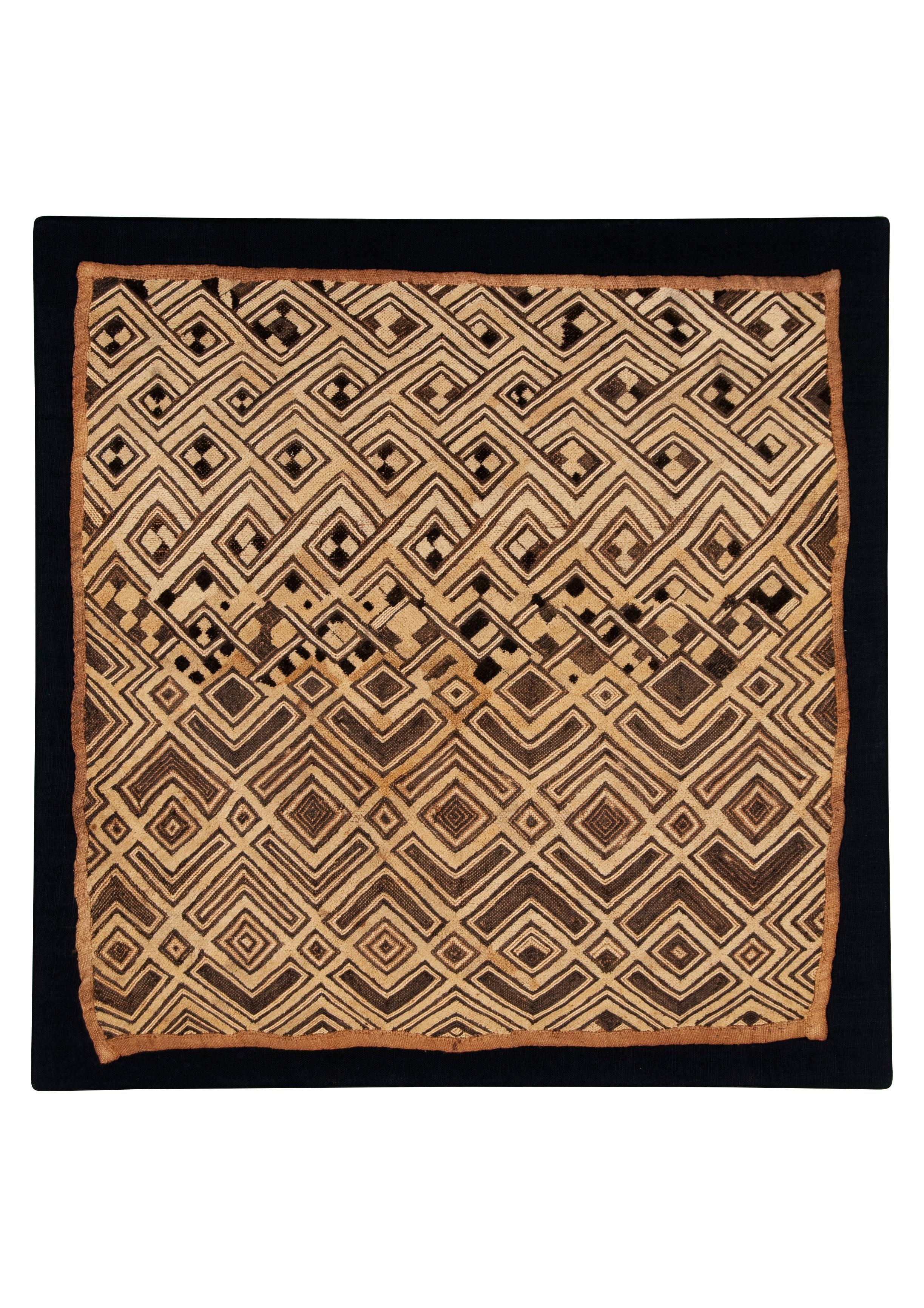 Antique Kuba Shoowa Cut-Pile & Embroidered Cloth, DR Congo

A graphically compelling example of a Kuba raffia fiber prestige cloth with cut pile and stitched embroidery. In very good condition. Mounted.
1st half 20th C
Width 24 inches, Height: 24.5