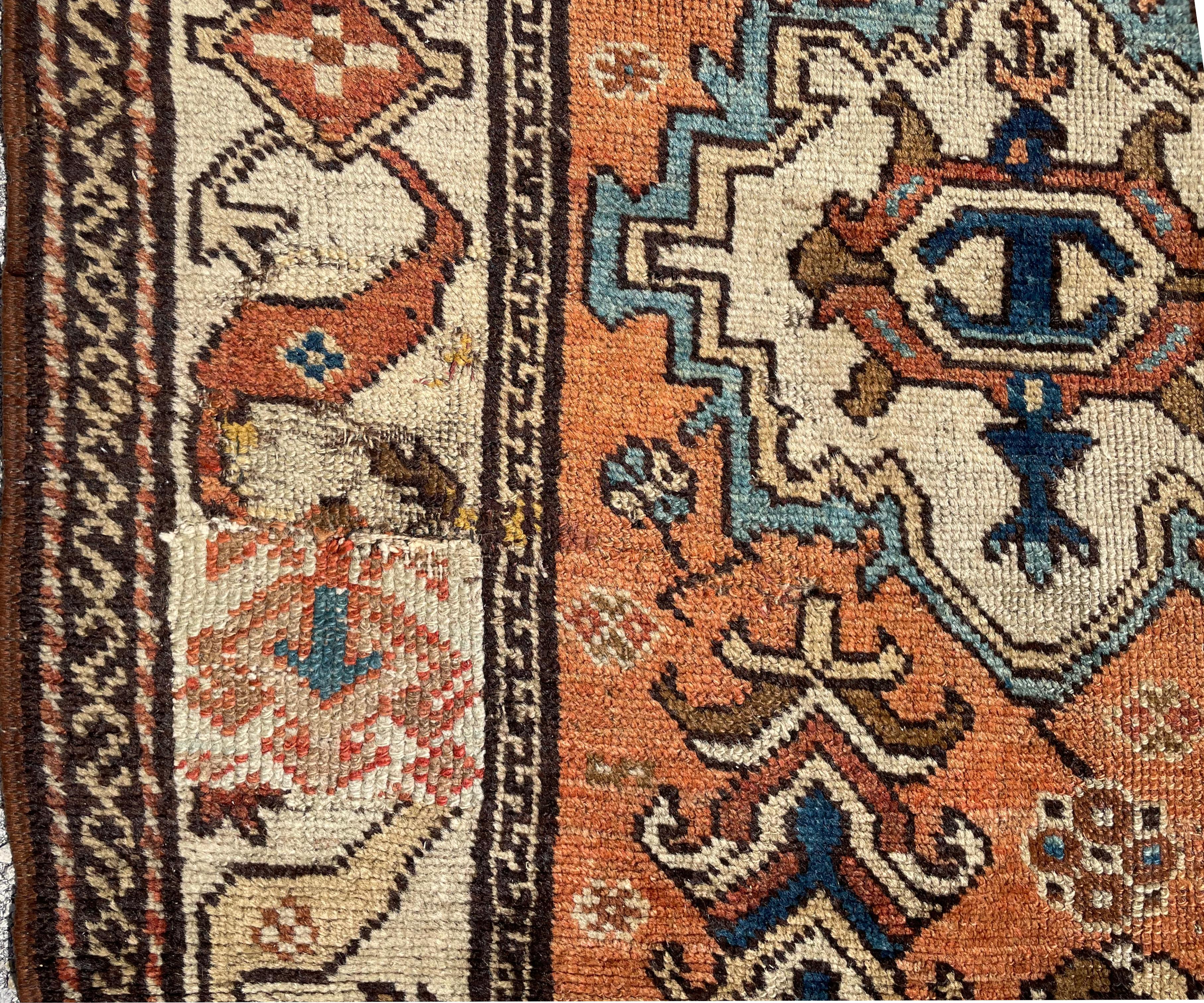 
Antique Kurdish Brergama, West Anatolia
Circa 1900. 
The center rust field with various large stylized flower heads, with scattered smaller blossoms and leafy bushes, the center cream border with a repeating pattern of connected diamonds and