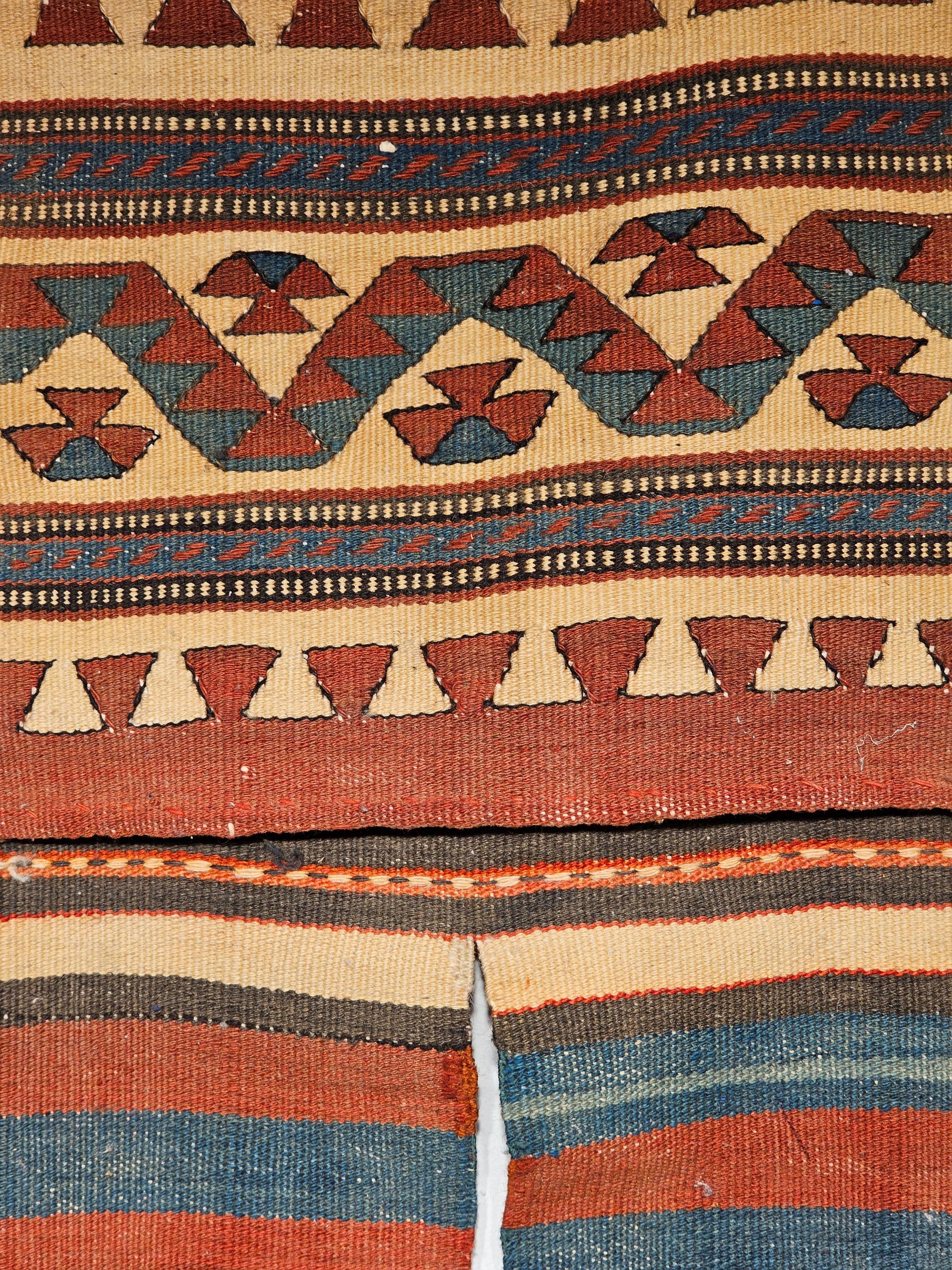 Beautiful and very rare Uzbek Double Kilim Saddlebags from the early 20th century.  The bag faces have geometric designs in indigo blue, brown, rust red and pale yellow similar to the design of bags from Caucasus or the Shahsavan Tribes of  NW