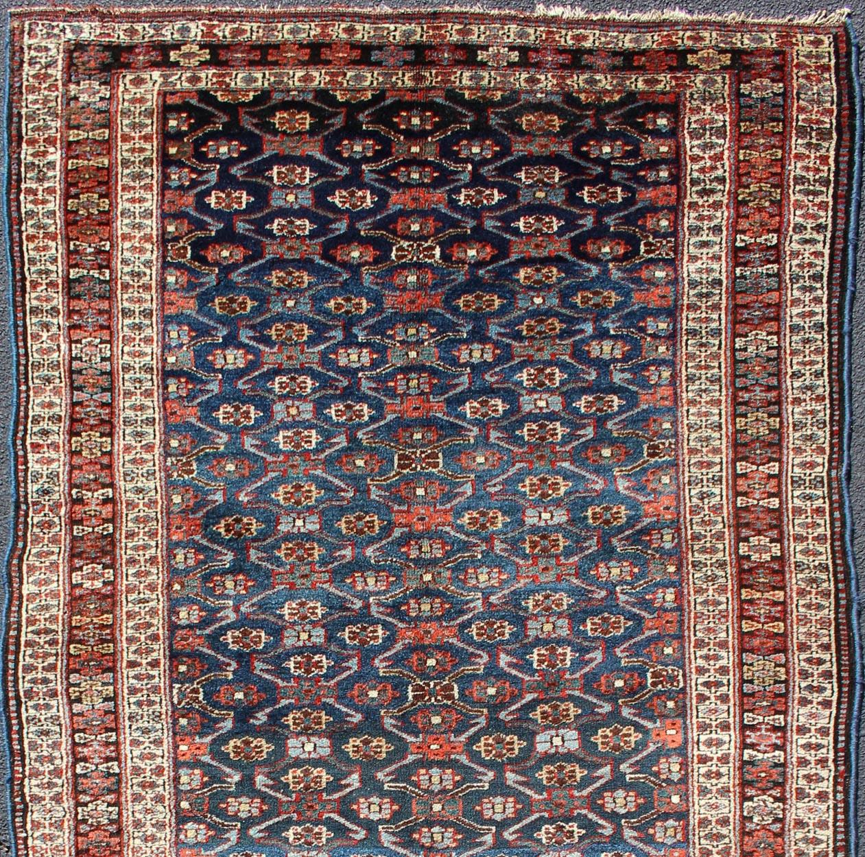 Antique Runner from Persia with geometric design in gray blue background, cream and brown border, with accent colors of red, blue, green and Light blue, rug 19-0808, country of origin / type: Iran / Kurdish, circa 1900.

This Kurdish carpet from