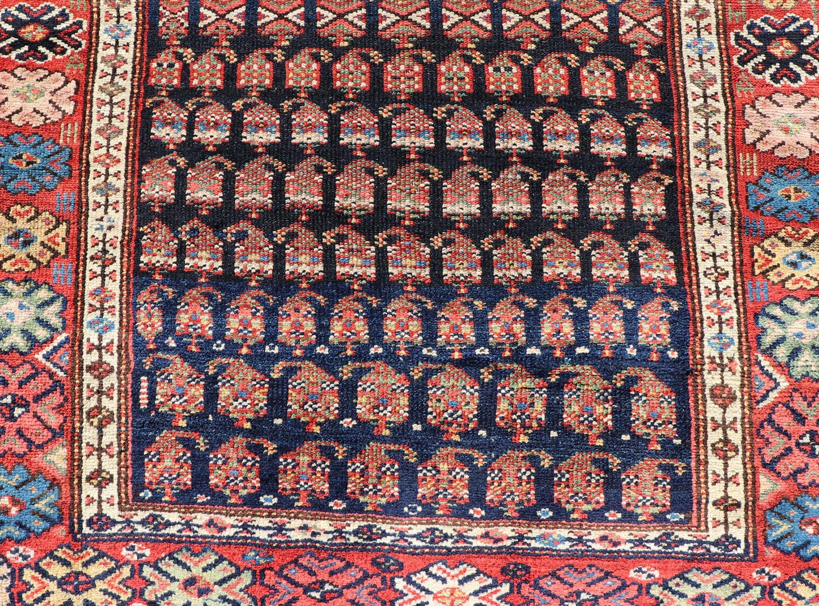 Measures: 3'10 x 9'4 
Antique Kurdish Gallery Runner In All-Over Geometric Design on a Blue Background. Country of Origin: Iran; Type: Kurdish; Design: Tribal, Floral, Tribal Motif; Keivan Woven Arts: Rug EMB-22154-15074. 

This antique gallery