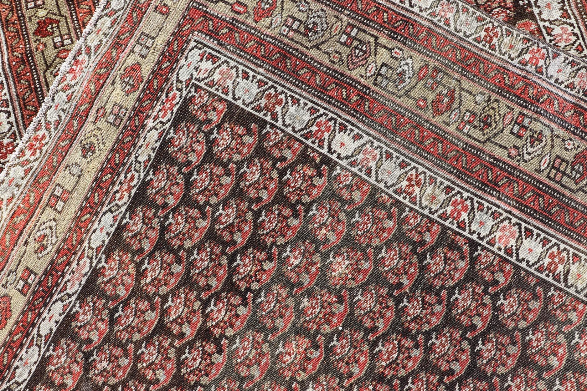 20th Century Antique Kurdish Gallery Runner with All-Over Paisley Design in Brown, Red, Green For Sale