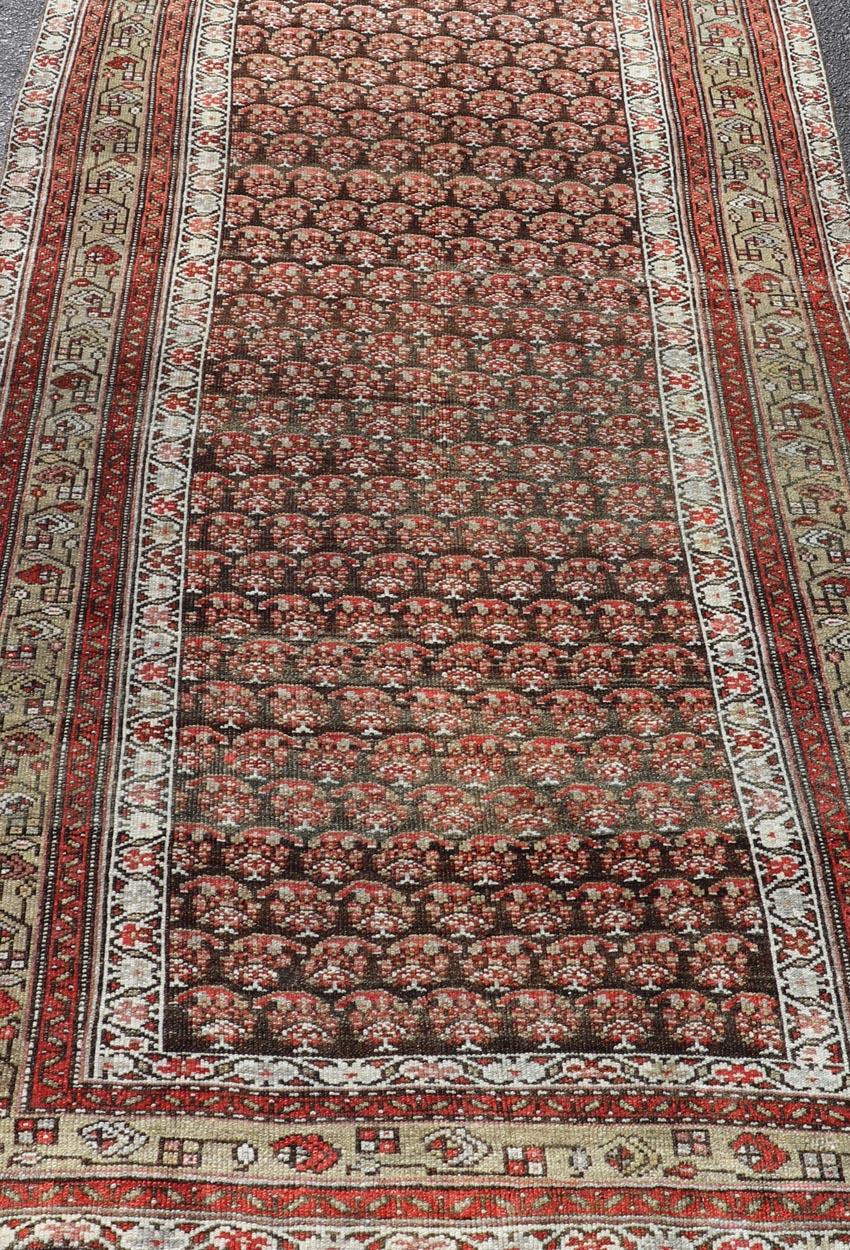 Antique Kurdish Gallery Runner with All-Over Paisley Design in Brown, Red, Green For Sale 1