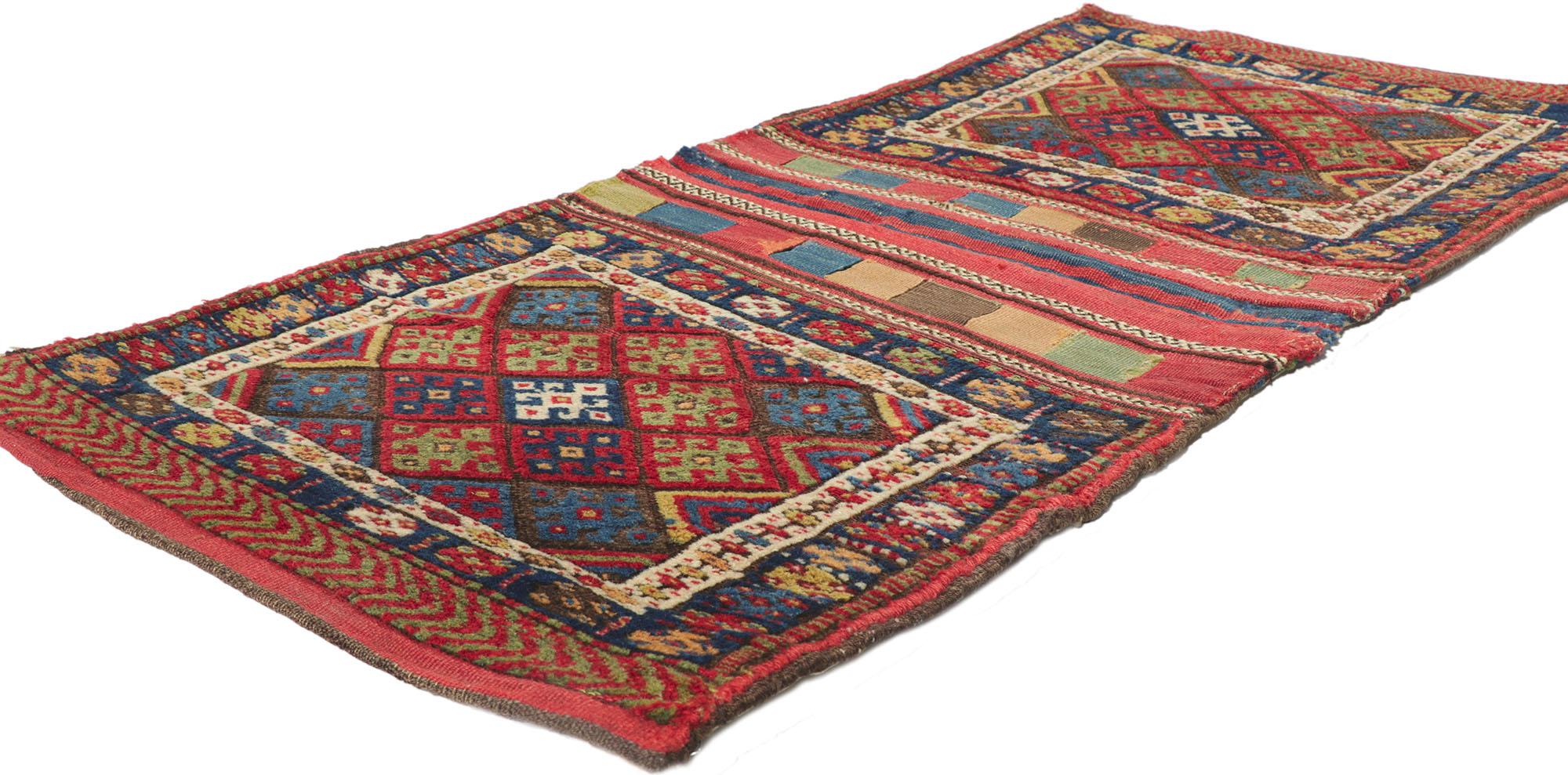 ?78192 Antique Kurdish Jaf Saddle Bag with Tribal Style 02'03 x 04'09. 
Warm and inviting with nomadic charm, this hand-knotted wool antique Kurdish Jaf saddle bag is a captivating vision of woven beauty. It features an all-over geometric pattern
