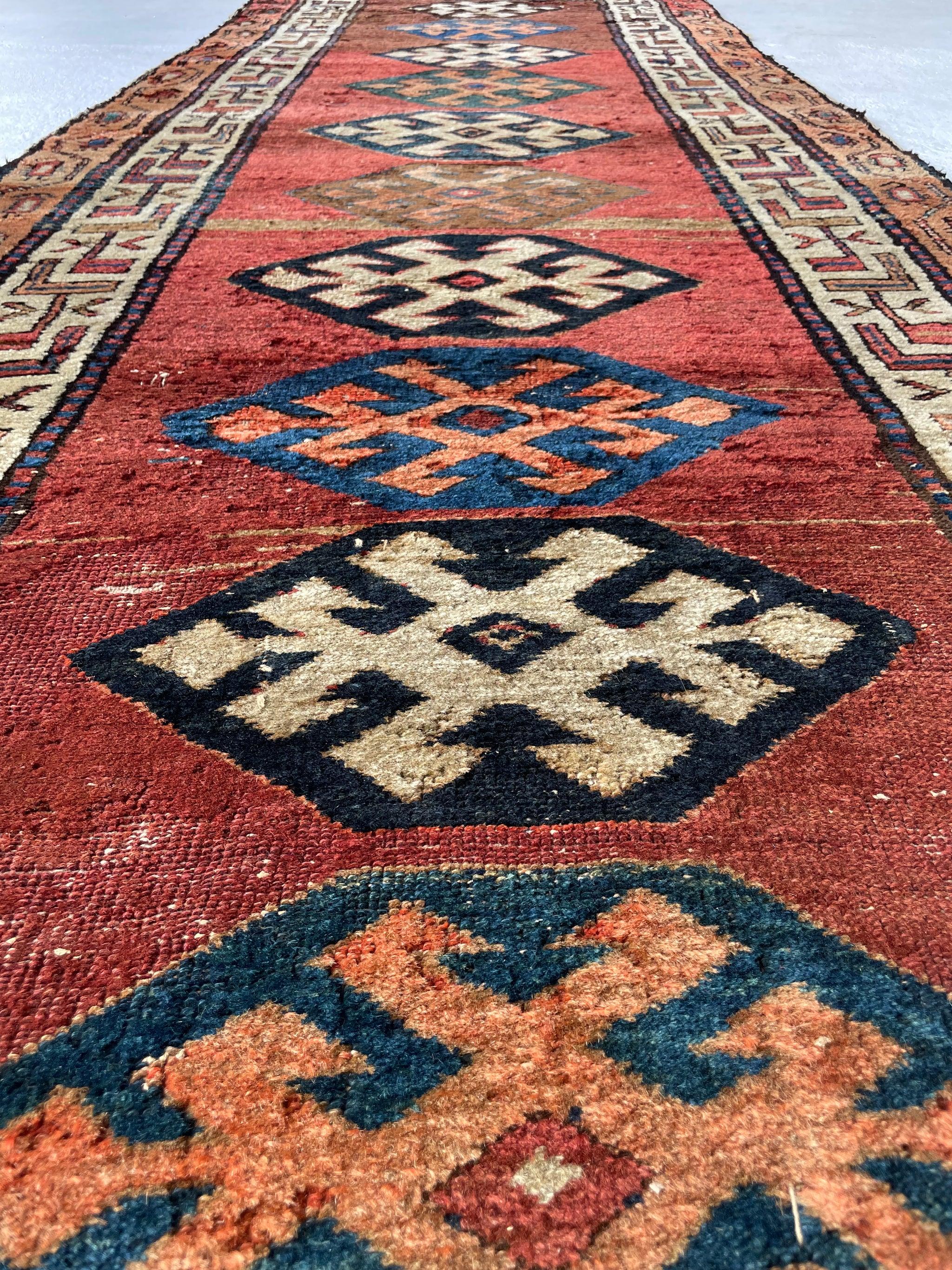 Unimaginably Beautiful Antique Kurdish-Kazak Geometric Motifs Rust, Emerald, Charcoal, Peacock Blue etc 

About: By far one of the most attractive runners we’ve ever had in our entities collection. So much spontaneous weaving, small batch dye lots