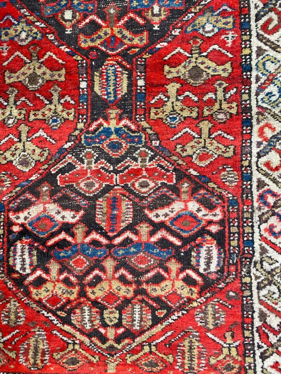 Very beautiful late 19th century Kurdish rug with a tribal geometrical design and nice natural colors with red and blue, entirely hand knotted with wool velvet on cotton foundation.