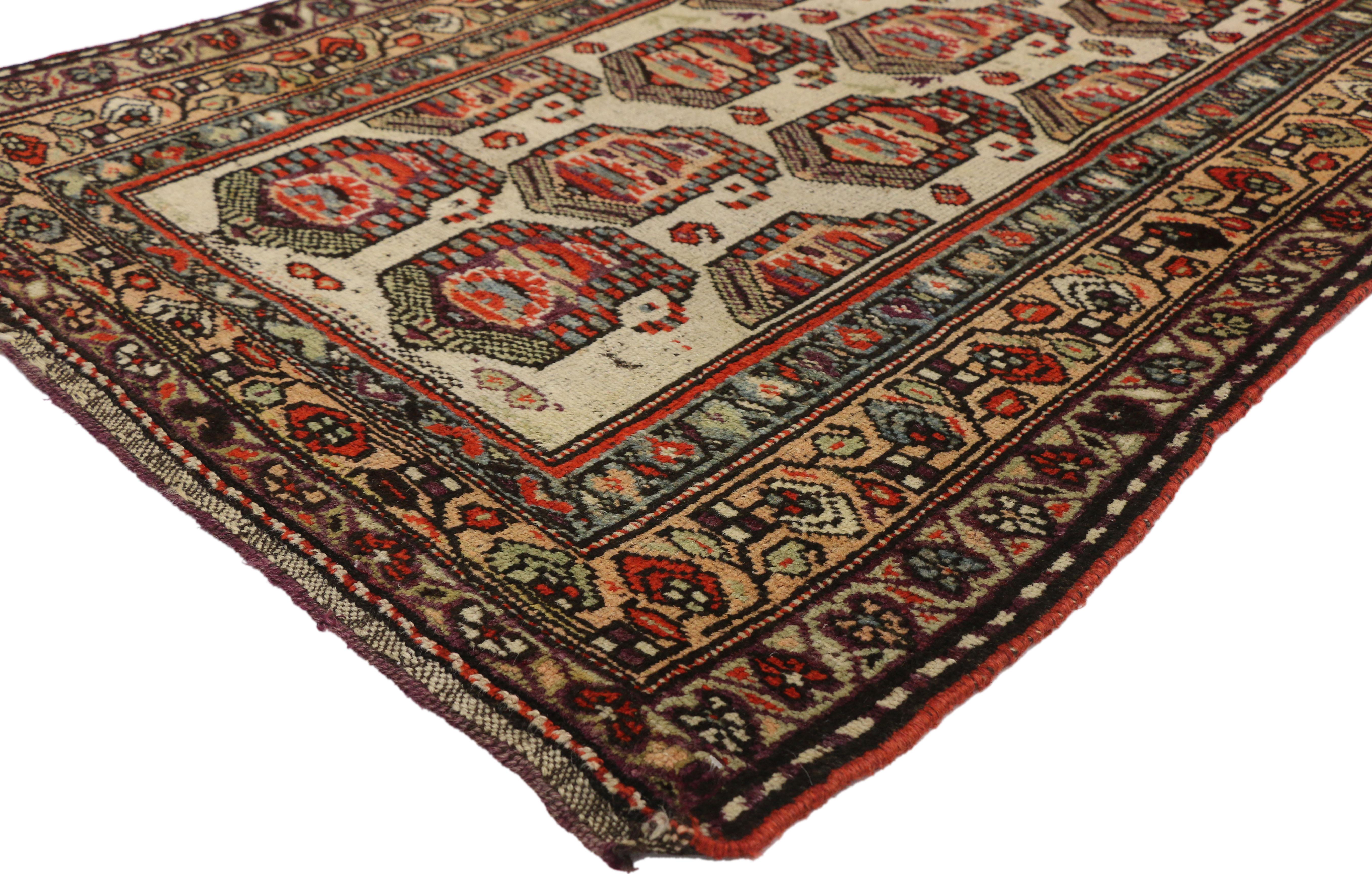 72613, antique Kurdish Persian Accent rug with boteh pattern in traditional style. This hand-knotted wool antique Kurdish Persian accent rug with a traditional style features diagonal rows of large-scale boteh, or paisley motifs. Smaller red boteh