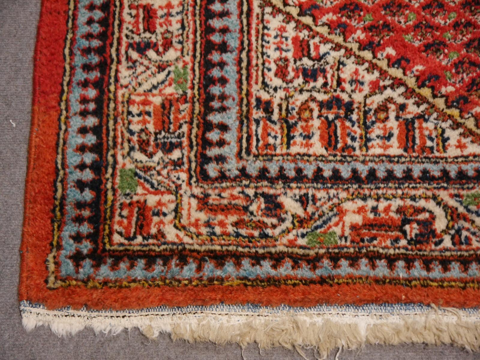 This breathtaking hand-knotted oriental rug was made of fine wool. It is very decorative and has a stunning luster. The burnt orange field contrasts with the creme border and corners. The carpet has a lot of character to give a room an elegant