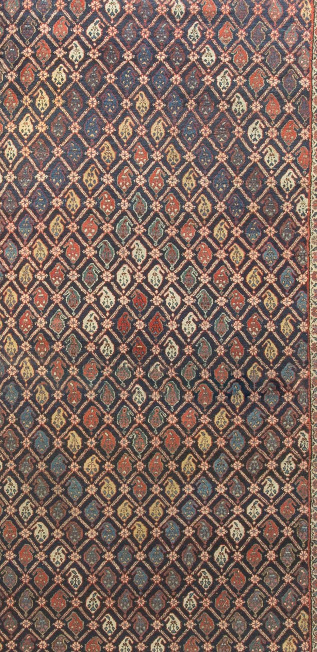 A wonderful design so expertly carried out in the weaving to create this overall diamond look. A hand woven Kurdish antique, circa 1900 handwoven rug.