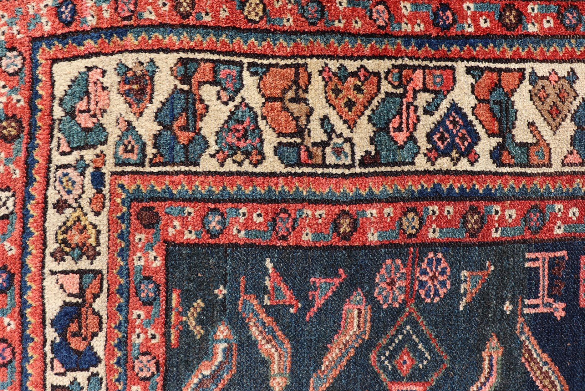 Antique Kurdish Rug With All-Over Geometric Design on a Blue Background. Country of Origin: Iran; Type: Kurdish; Design: Tribal, Floral, Tribal Motif; Keivan Woven Arts: Rug X23-0103. 
Measures: 4'6 x 8'0 
This antique rug from Persia features