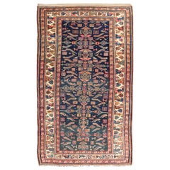 Tapis kurde ancien à motifs géométriques sur fond bleu