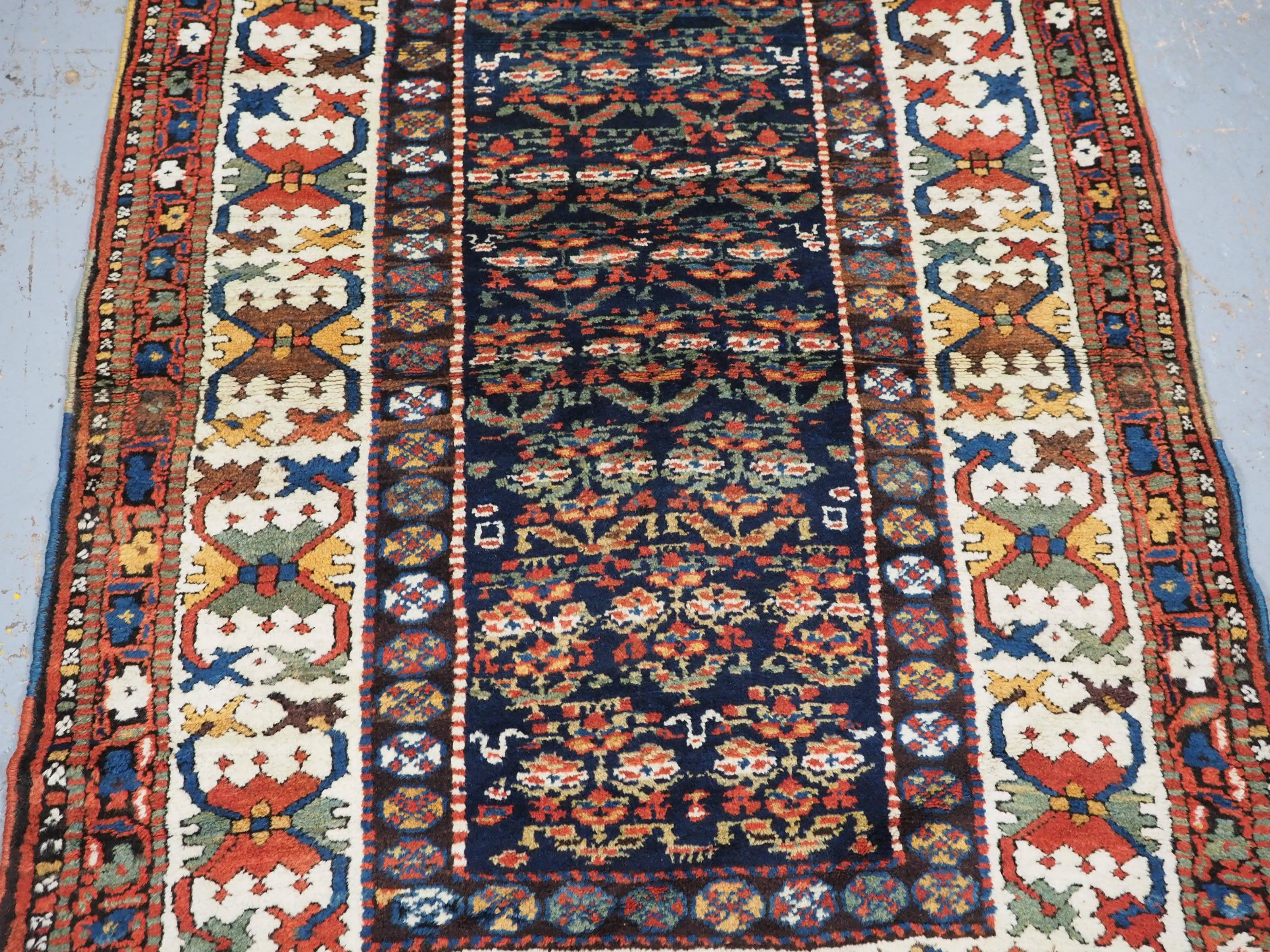 Early 20th Century Antique Kurdish rug with colourful shrub design.  Circa 1900 For Sale