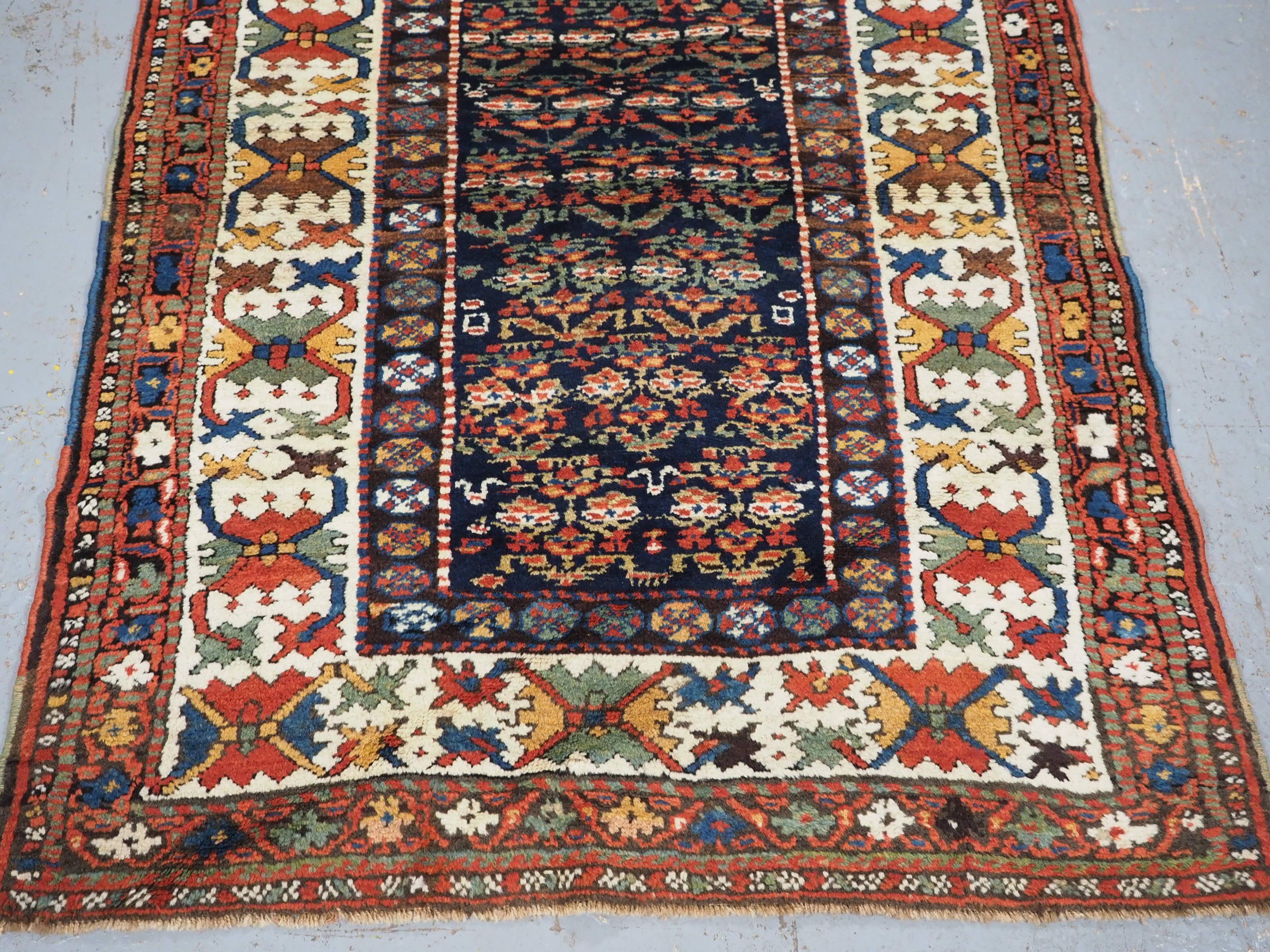 Wool Antique Kurdish rug with colourful shrub design.  Circa 1900 For Sale