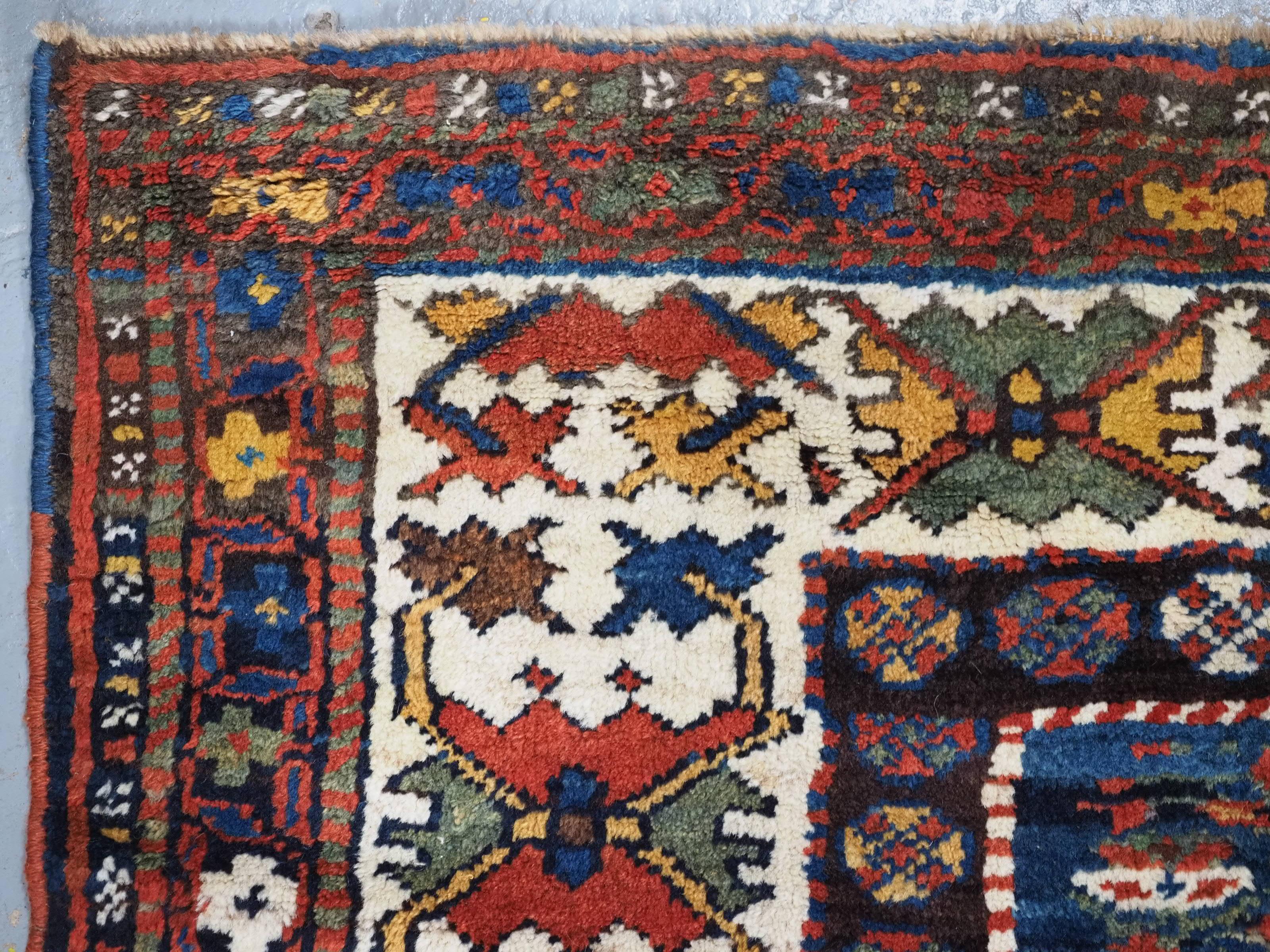 Antique Kurdish rug with colourful shrub design.  Circa 1900 For Sale 1