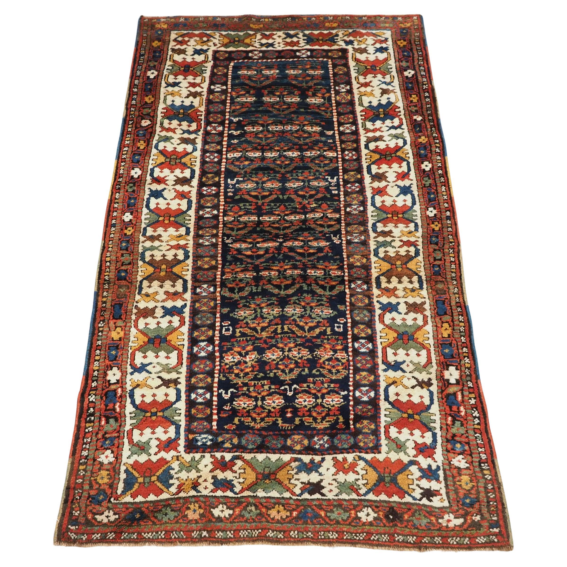 Antique Kurdish rug with colourful shrub design.  Circa 1900 For Sale